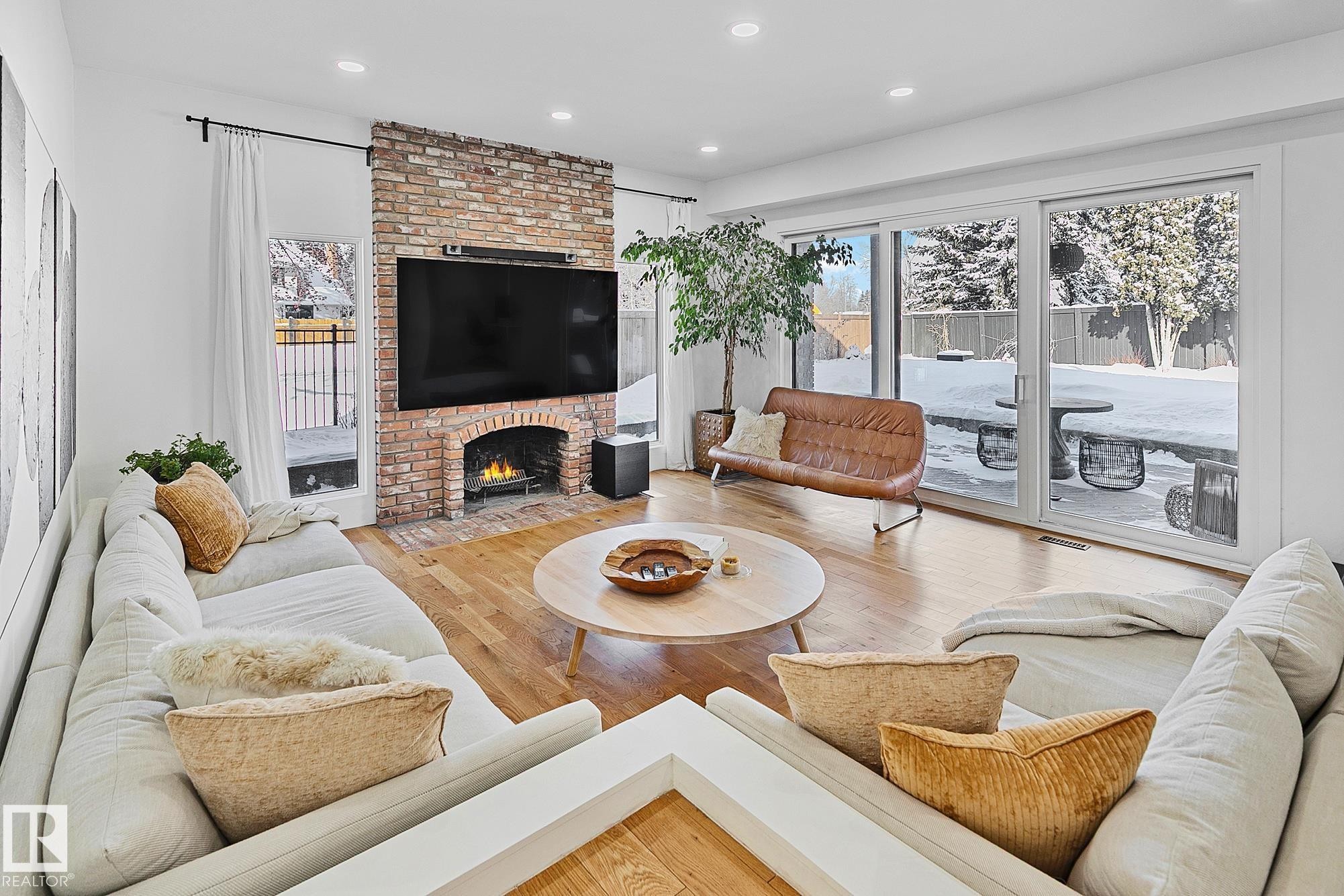 100 Wolf Willow Crescent, Edmonton, AB - Indoor Photo Showing Living Room With Fireplace