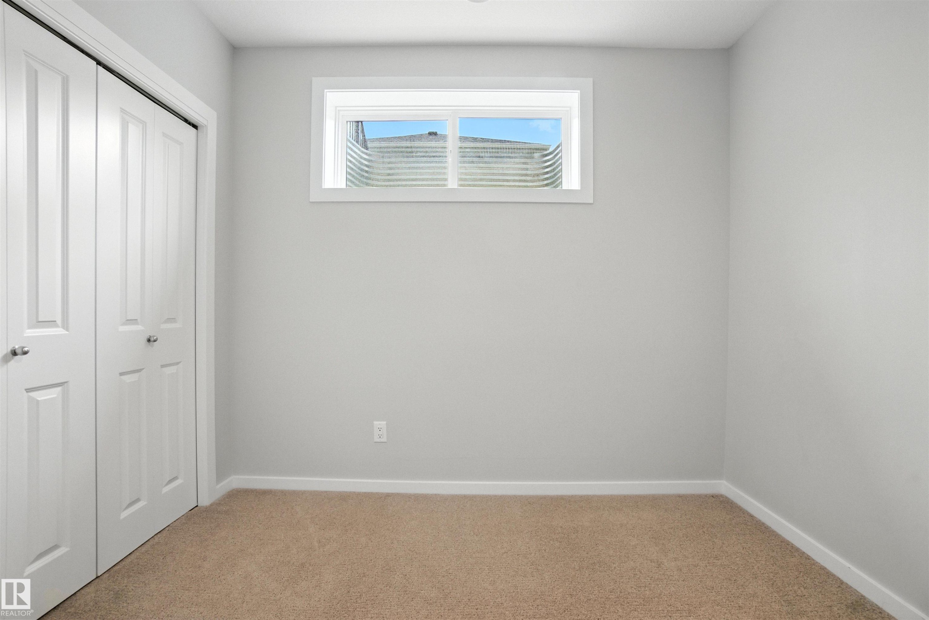 Unfurnished bedroom featuring carpet floors and a closet - 20727 25 Ave, Edmonton, AB - Indoor Photo Showing Other Room
