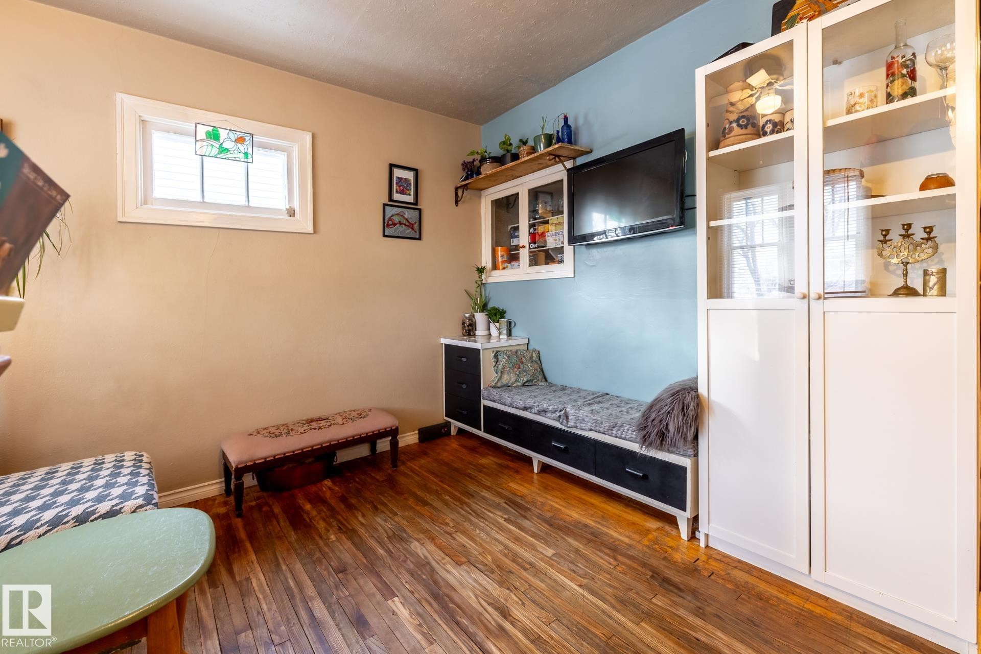 Bedroom featuring dark wood-type flooring and baseboards - 11240 84 Street, Edmonton, AB - Indoor Photo Showing Other Room
