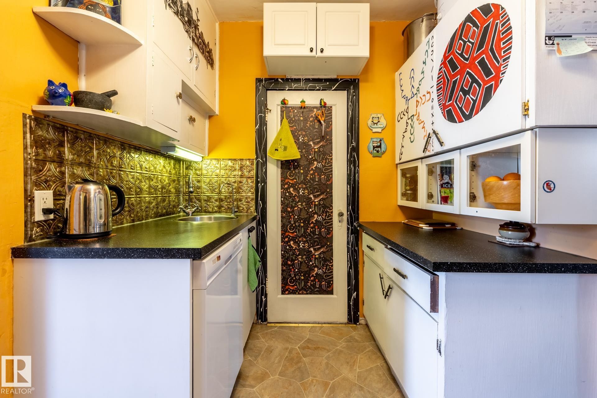 Kitchen featuring open shelves, white cabinetry, dark countertops, dishwasher, and tasteful backsplash - 11240 84 Street, Edmonton, AB - Indoor