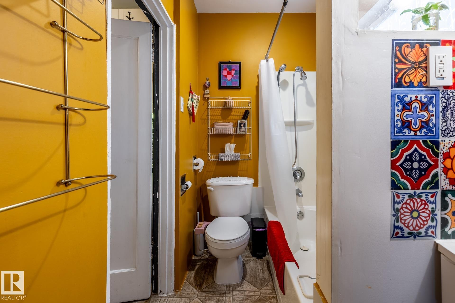 Bathroom featuring toilet and shower / tub combo - 11240 84 Street, Edmonton, AB - Indoor Photo Showing Bathroom