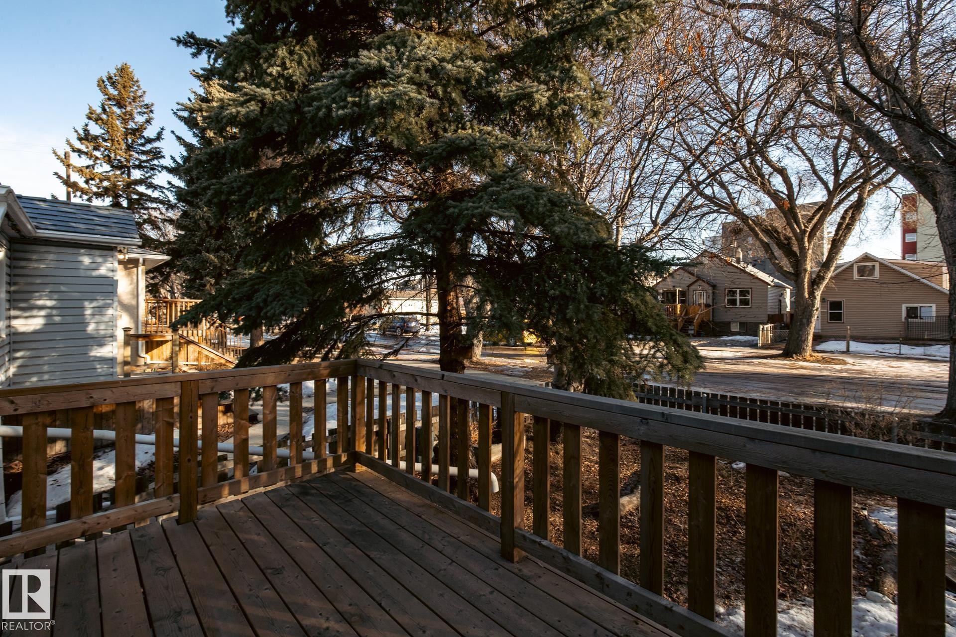 Wooden deck featuring a residential view - 11240 84 Street, Edmonton, AB - Outdoor