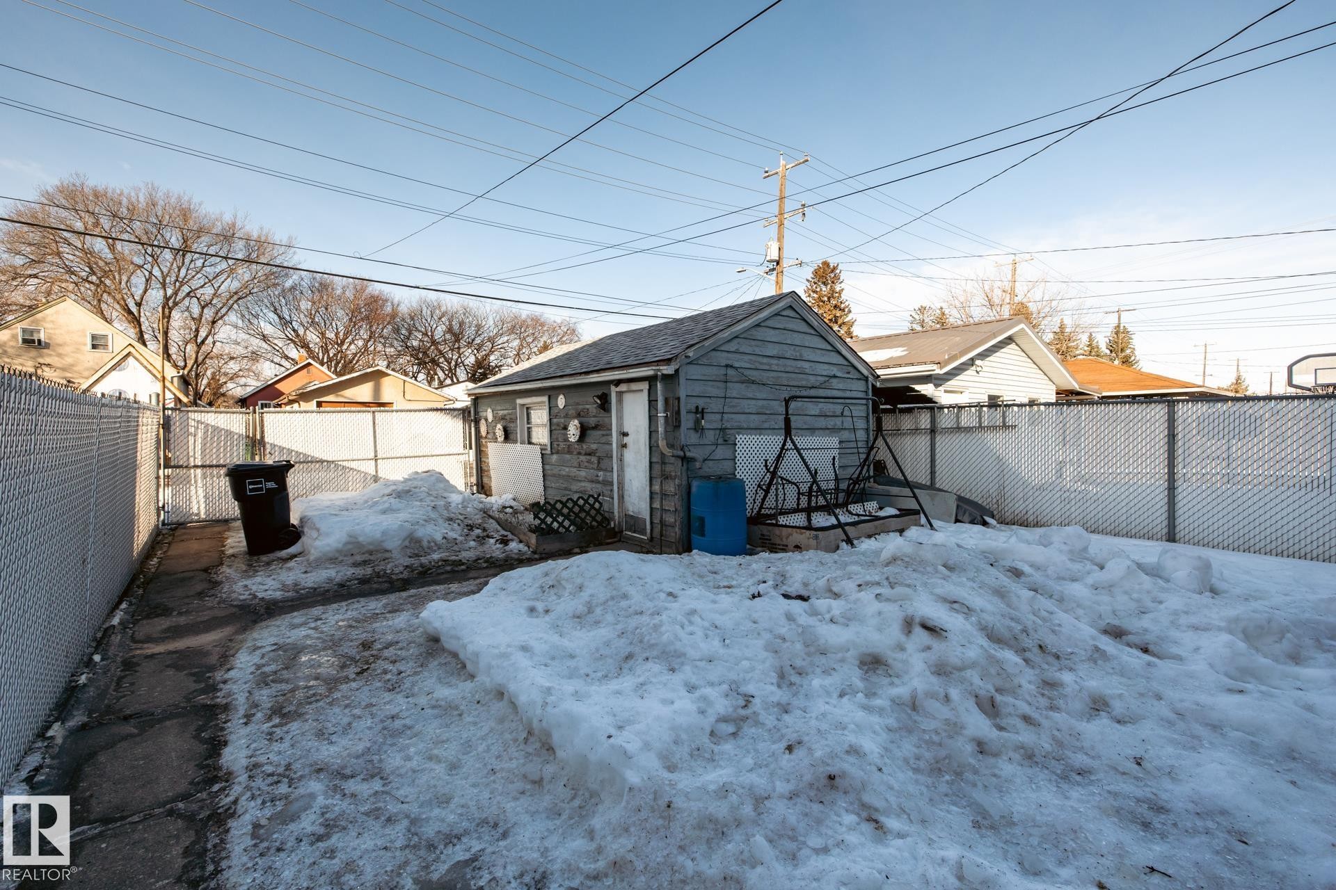 Fenced backyard featuring an outbuilding - 11240 84 Street, Edmonton, AB - Outdoor