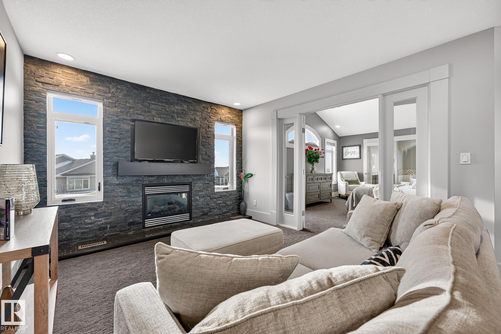 4001 Triomphe Boulevard, Beaumont, AB - Indoor Photo Showing Living Room With Fireplace