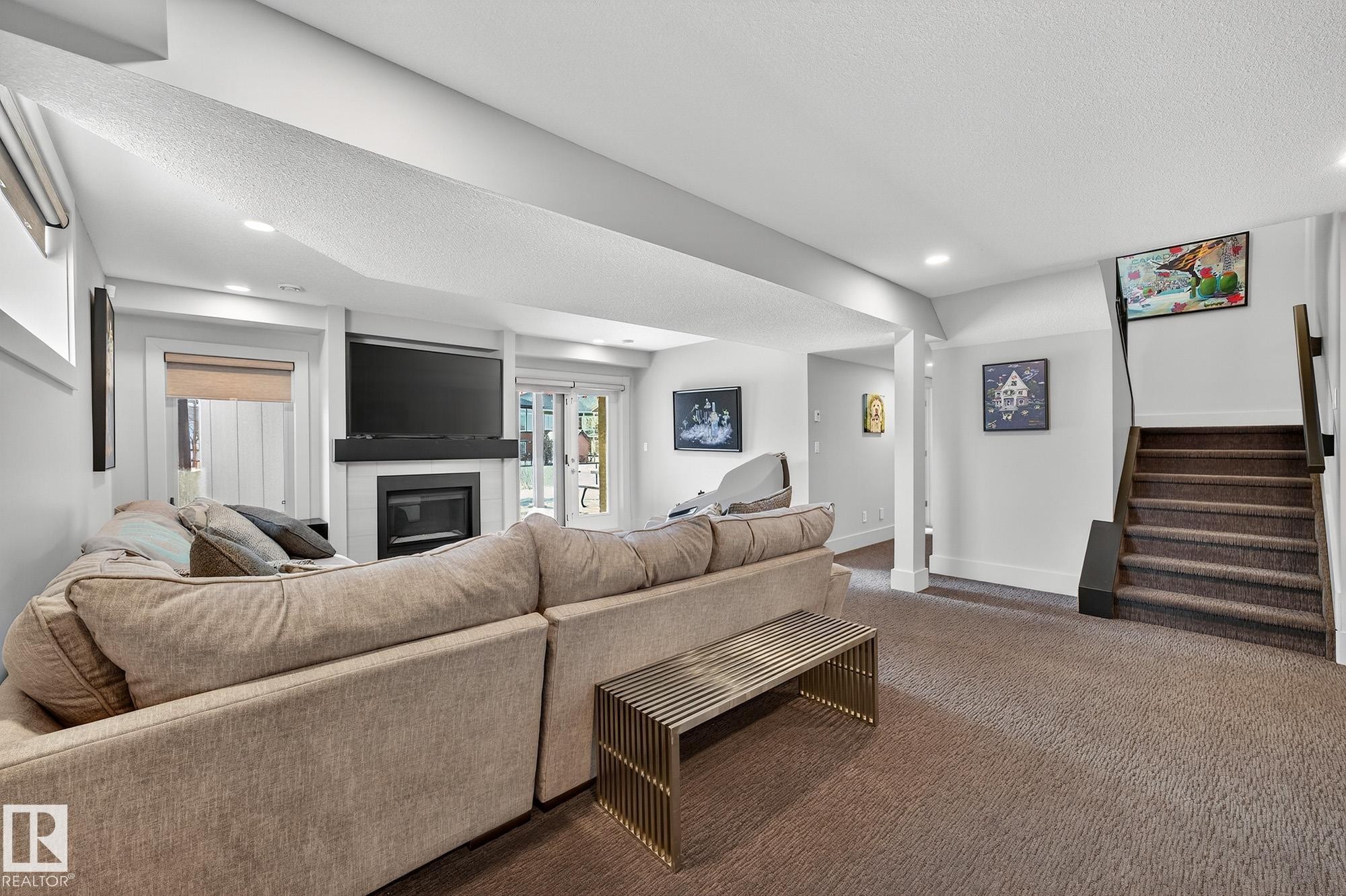 4001 Triomphe Boulevard, Beaumont, AB - Indoor Photo Showing Living Room With Fireplace