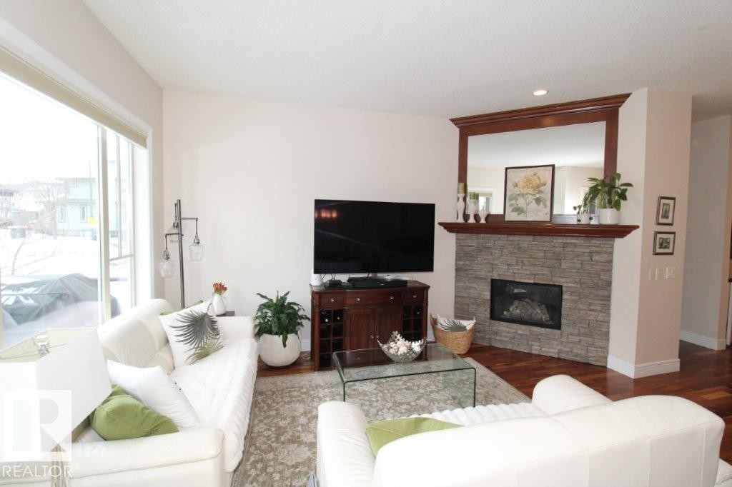 176 Ambleside Drive, Edmonton, AB - Indoor Photo Showing Living Room With Fireplace