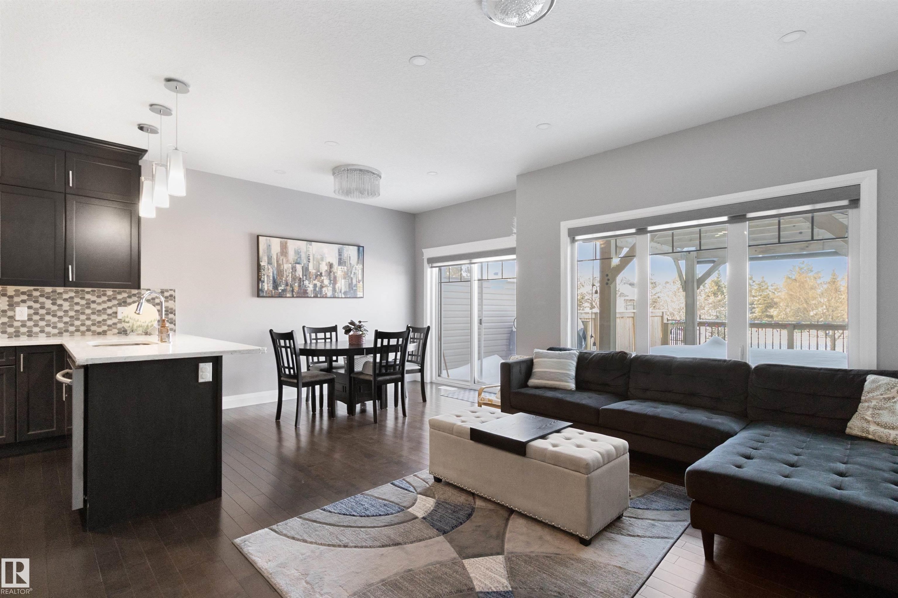 Living area featuring dark wood-type flooring - 56 Durrand Bend, Fort Saskatchewan, AB - Indoor Photo Showing Living Room