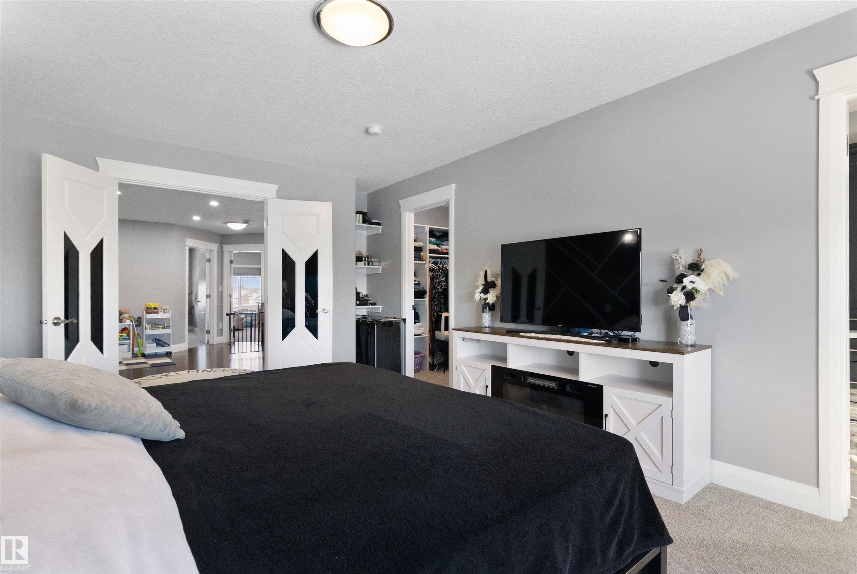 Bedroom with a spacious closet and light colored carpet - 56 Durrand Bend, Fort Saskatchewan, AB - Indoor Photo Showing Bedroom