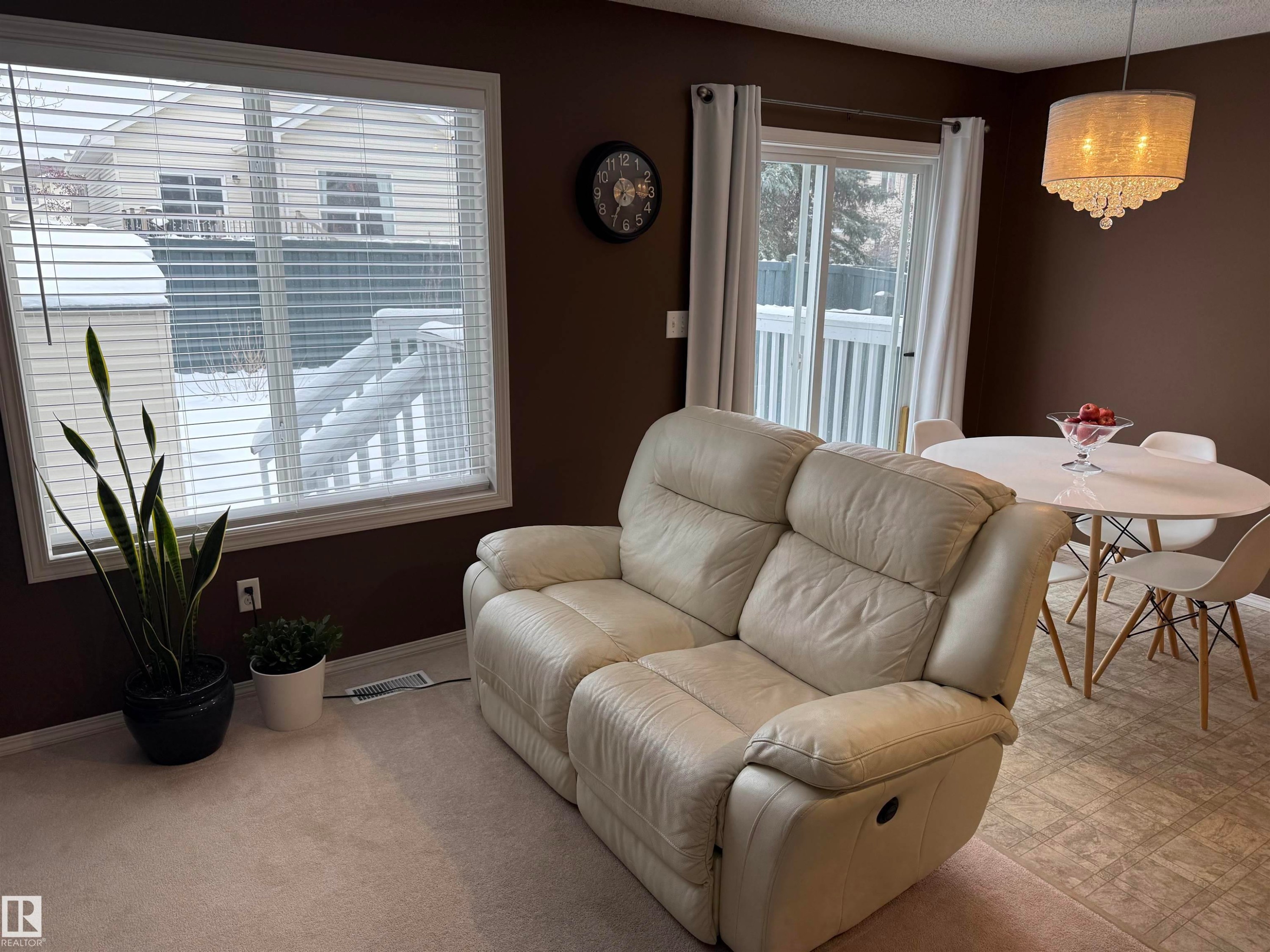 Living area featuring carpet flooring and a textured ceiling - 19 2021 Grantham Crest, Edmonton, AB - Indoor
