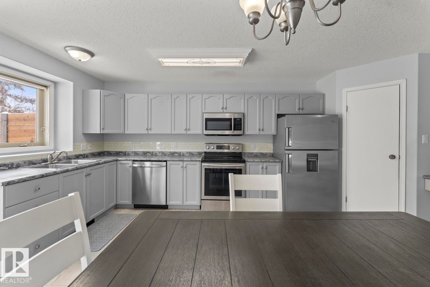 1006 11 Street, Cold Lake, AB - Indoor Photo Showing Kitchen With Double Sink