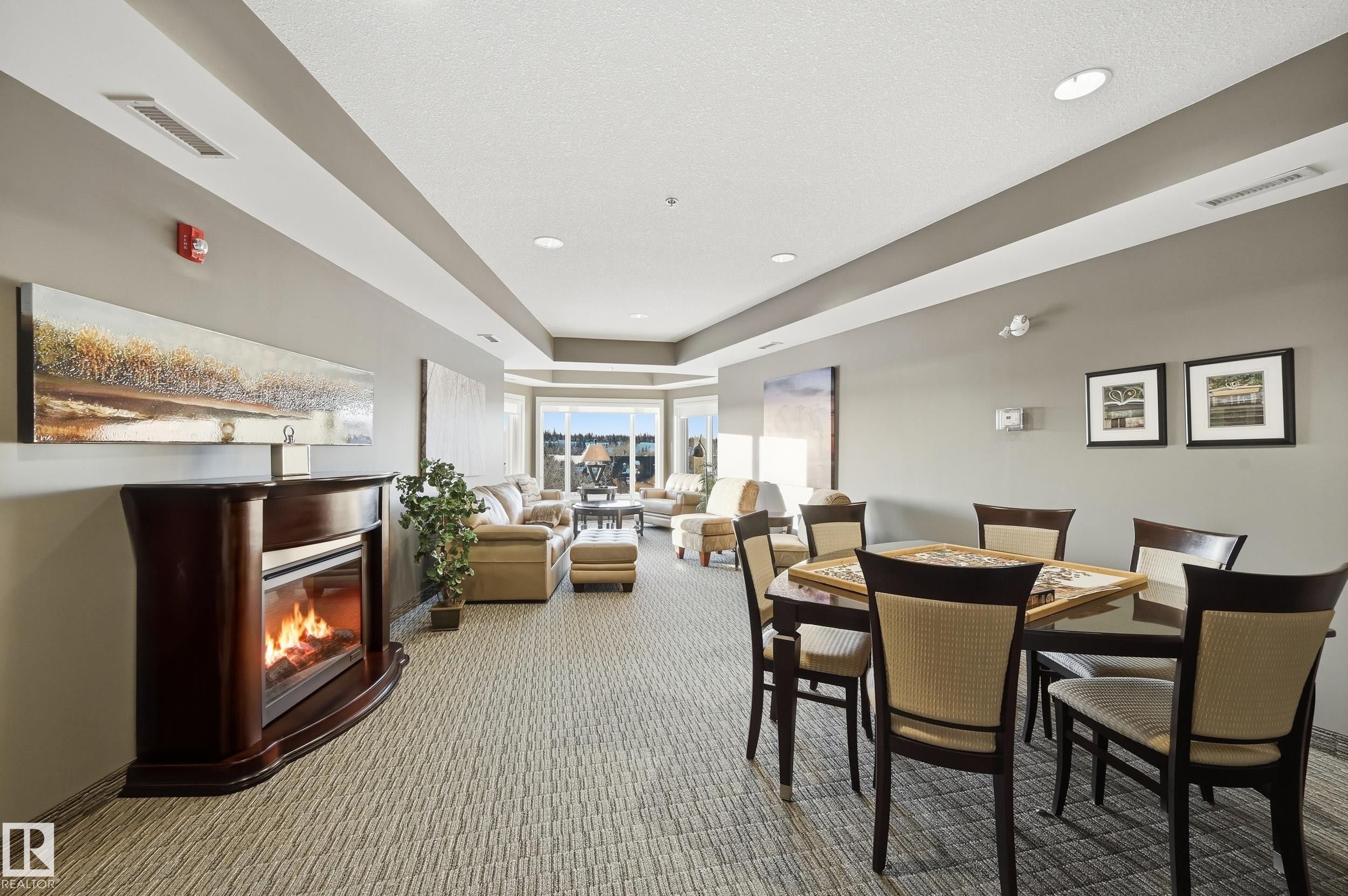 3 35 Sturgeon Road, St. Albert, AB - Indoor Photo Showing Dining Room With Fireplace