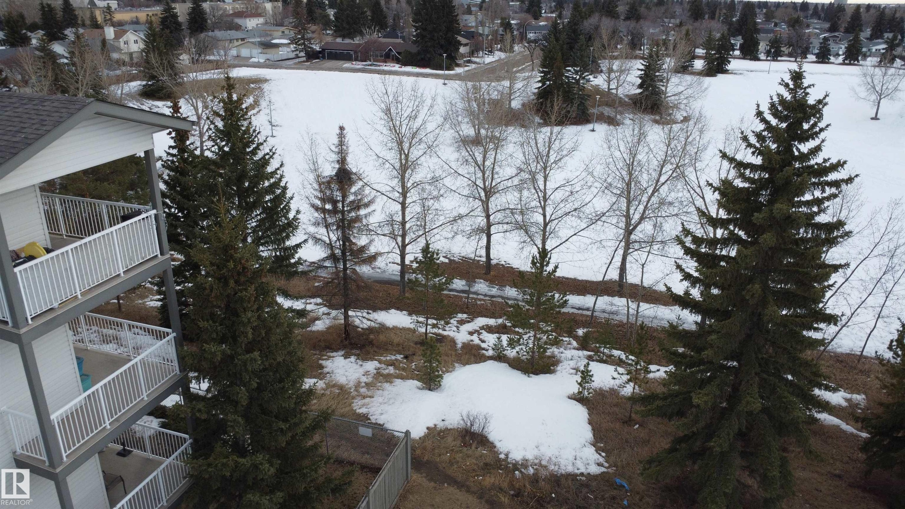 View of snowy aerial view - 227 16807 100 Avenue, Edmonton, AB - Outdoor With View