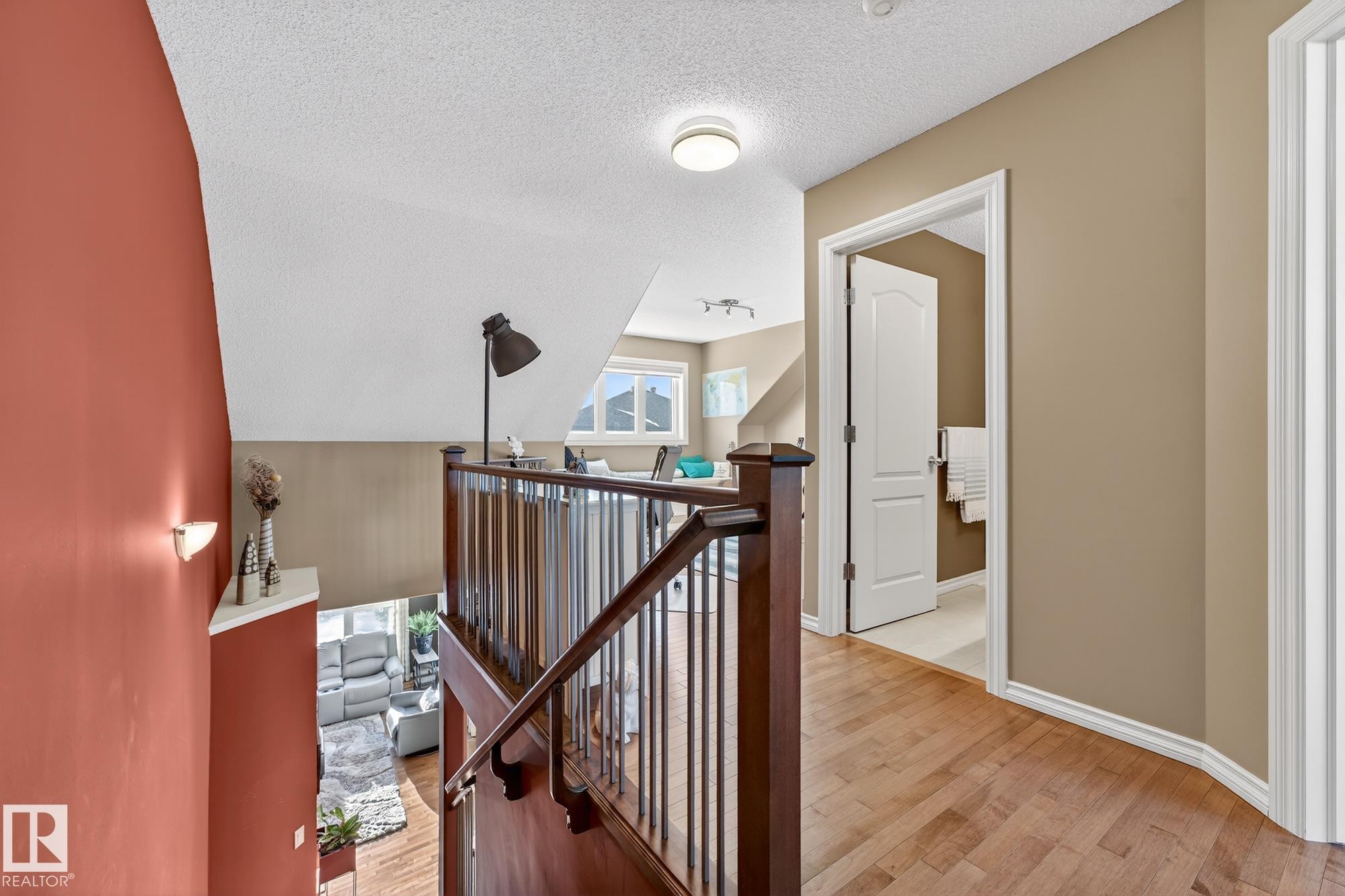 Hall with a textured ceiling, an upstairs landing, and light wood-style floors - 2036 Hilliard Place, Edmonton, AB - Indoor Photo Showing Other Room