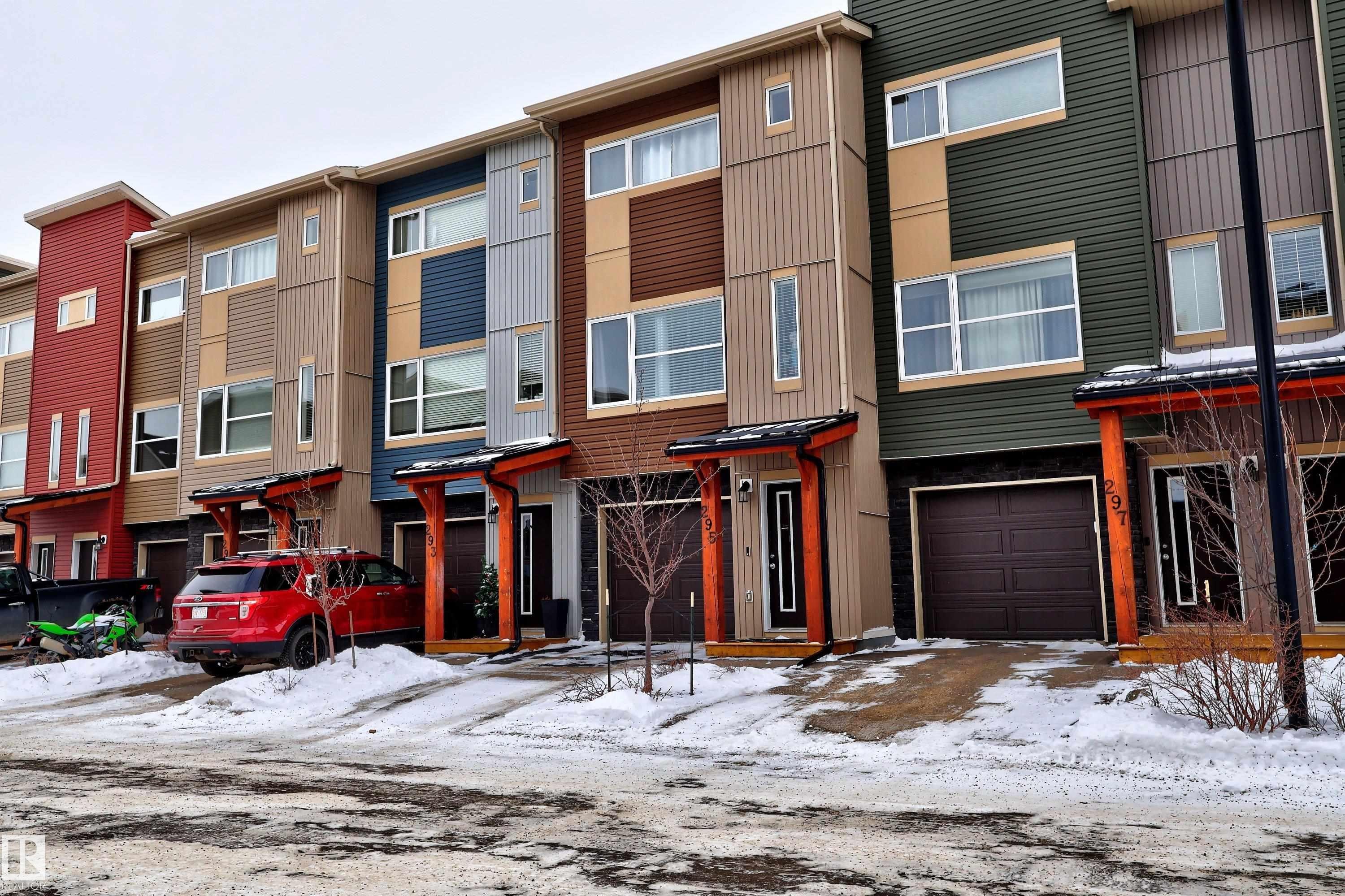 View of front of house featuring a garage - 295 401 Southfork Drive, Leduc, AB - Outdoor With Facade
