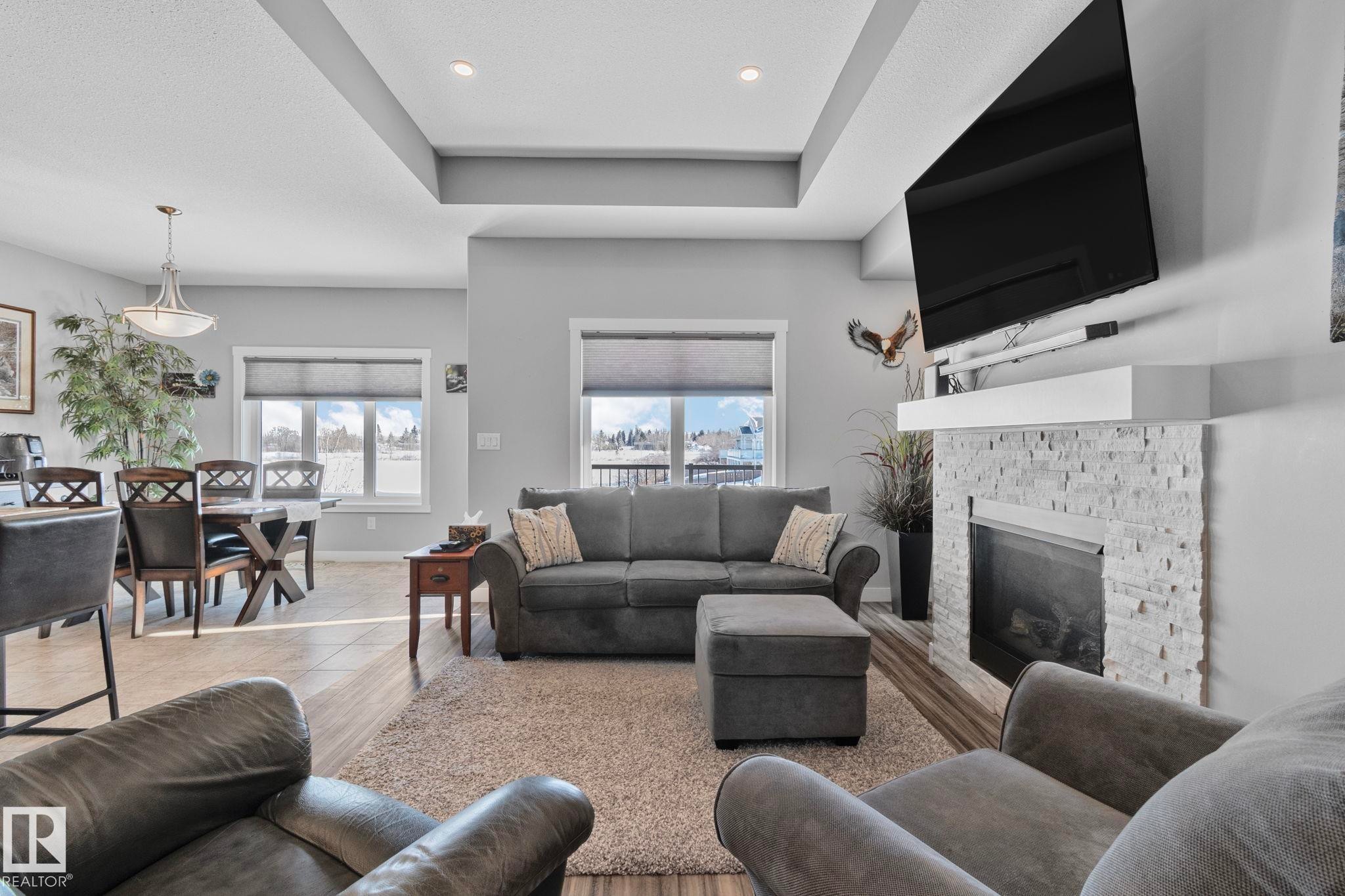 105 Houle Drive, Morinville, AB - Indoor Photo Showing Living Room With Fireplace