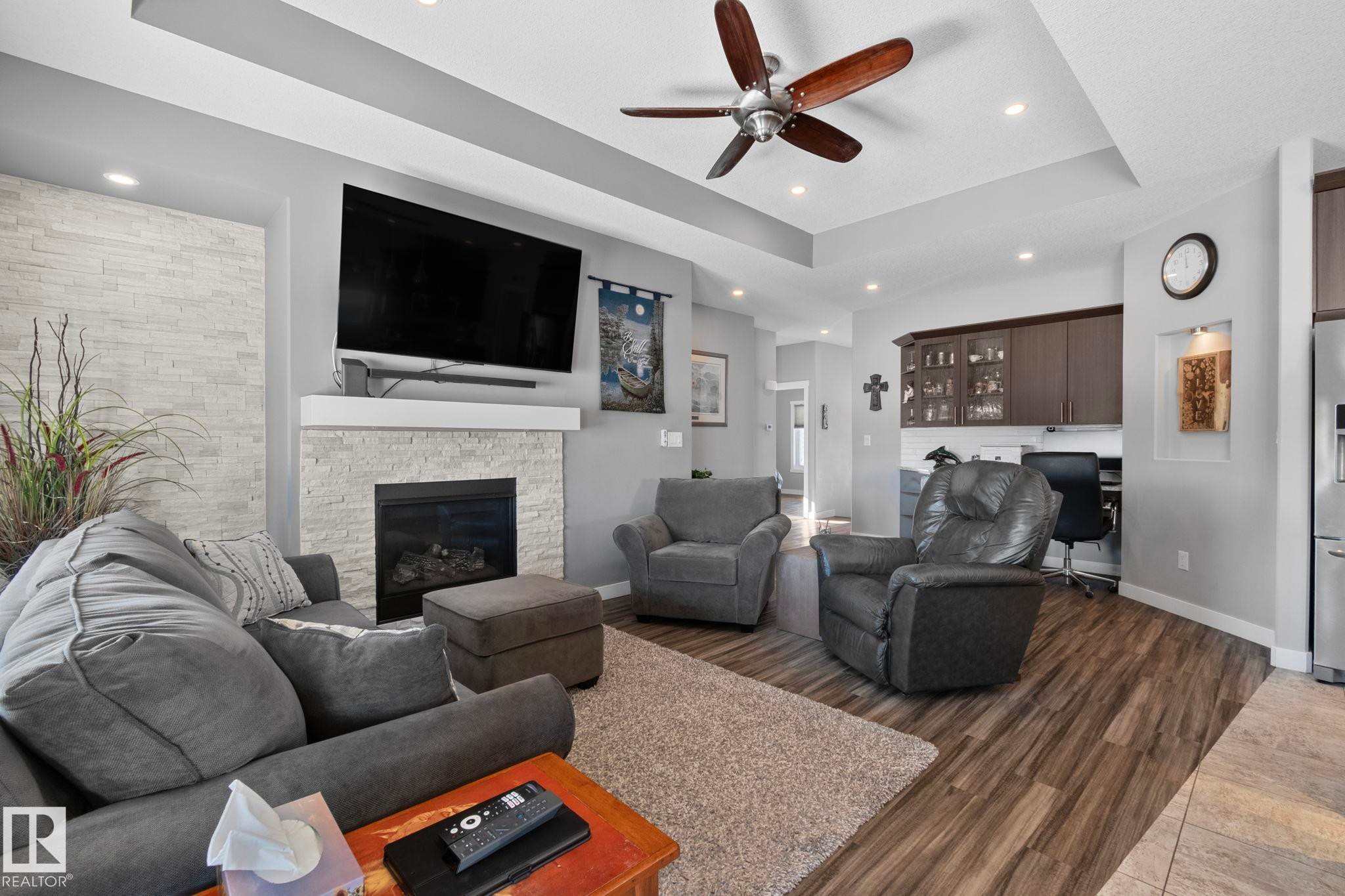 105 Houle Drive, Morinville, AB - Indoor Photo Showing Living Room With Fireplace