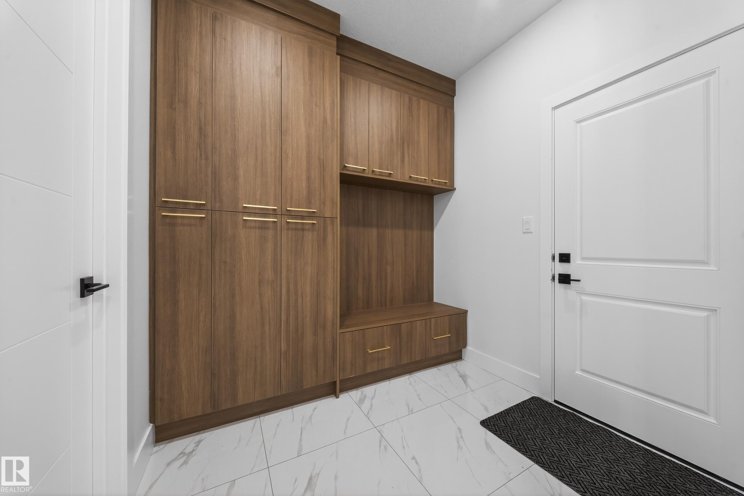 Mudroom with light marble finish floors and baseboards - 4006 40 Street, Beaumont, AB - Indoor Photo Showing Other Room