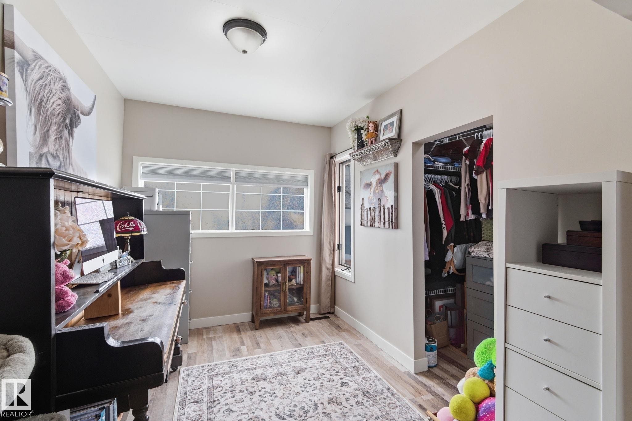 Office area featuring light wood-style flooring - 4919 50 Avenue, Bon Accord, AB - Indoor