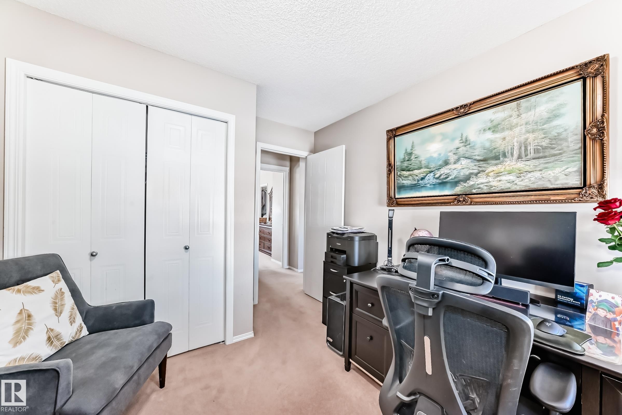 Office area featuring light colored carpet and a textured ceiling - 14043 151 Avenue, Edmonton, AB - Indoor Photo Showing Office