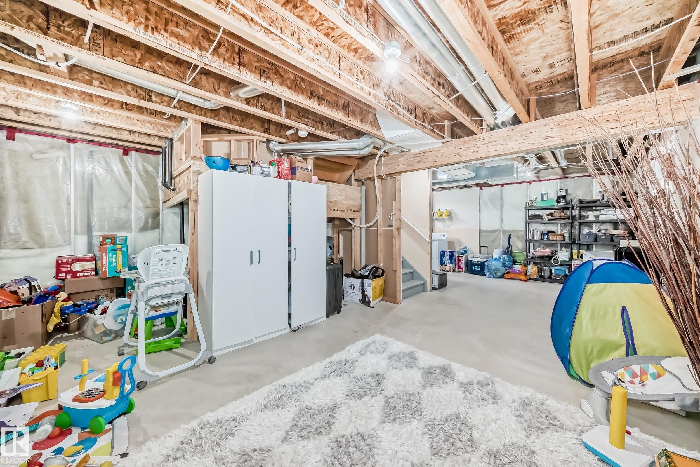 Unfinished below grade area with stairway - 14043 151 Avenue, Edmonton, AB - Indoor Photo Showing Basement