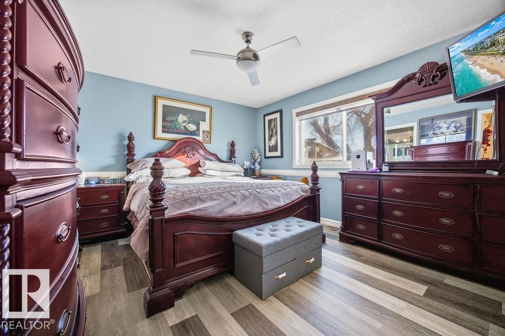 Bedroom featuring ceiling fan and wood finished floors - 3011 44A Street, Edmonton, AB - Indoor Photo Showing Bedroom