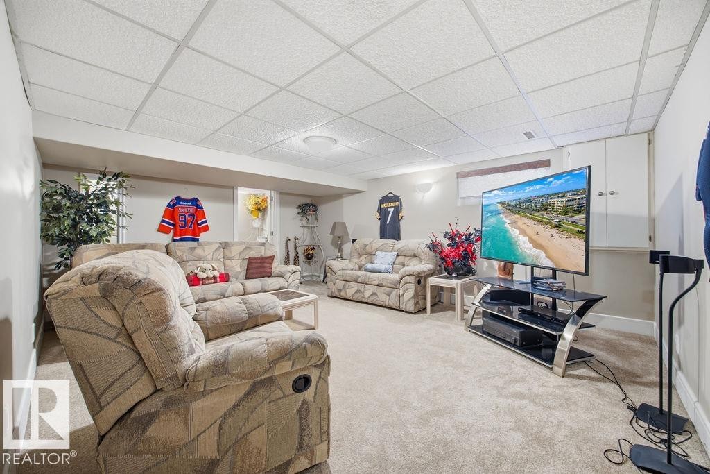 Living area with carpet floors and a drop ceiling - 3011 44A Street, Edmonton, AB - Indoor