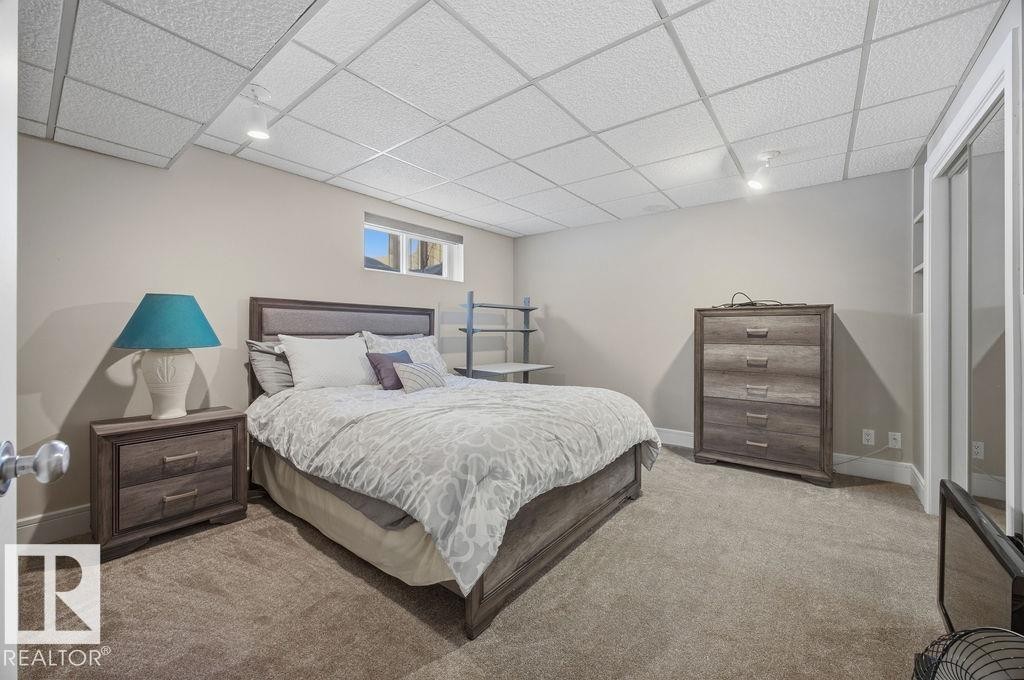 Bedroom with a drop ceiling, carpet, and track lighting - 3011 44A Street, Edmonton, AB - Indoor Photo Showing Bedroom