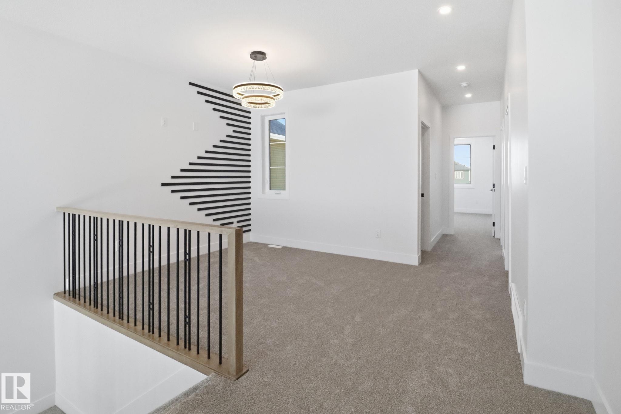 Hallway featuring light colored carpet and recessed lighting - 90 Eldridge Point(E), St. Albert, AB - Indoor Photo Showing Other Room