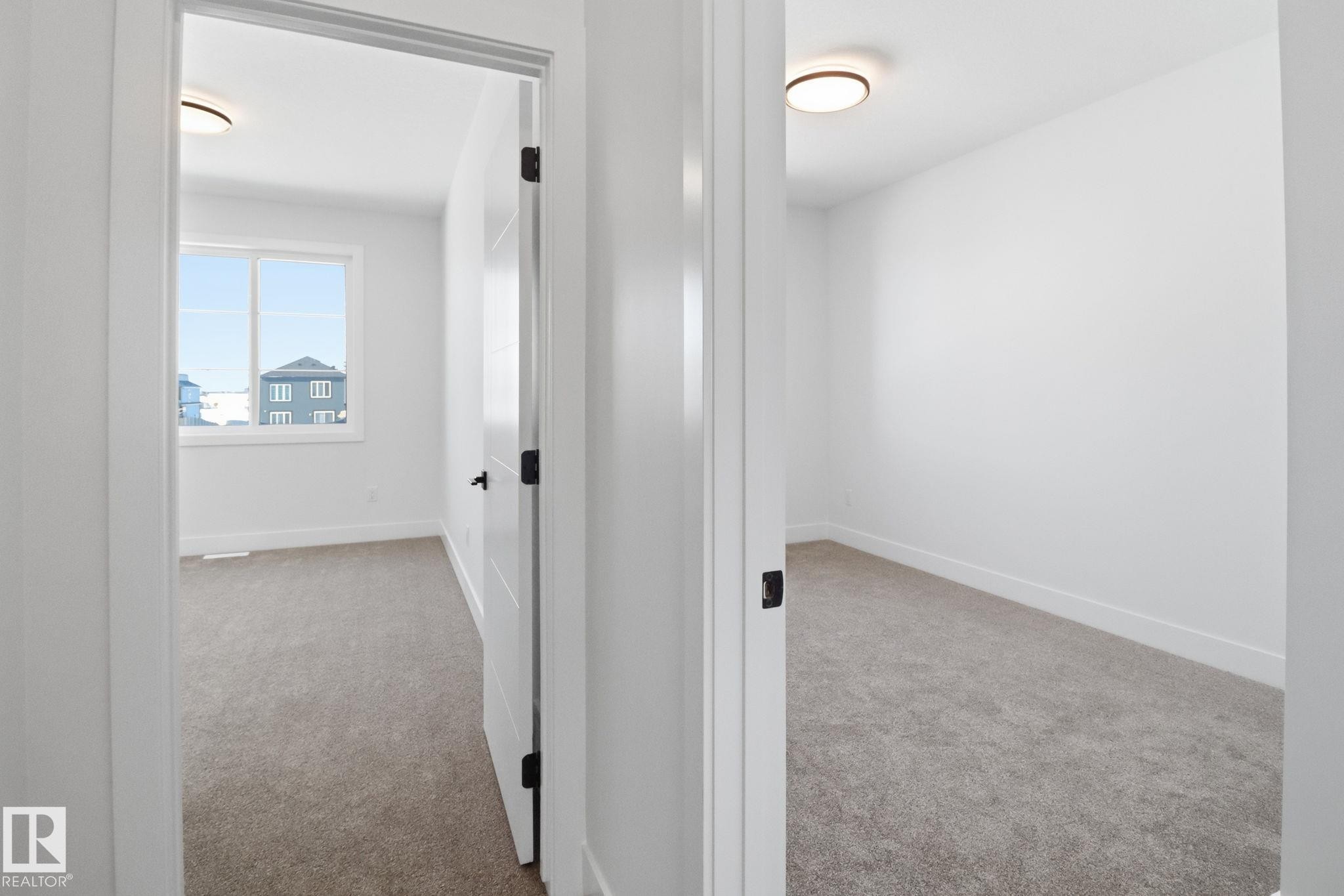 Corridor featuring light carpet - 90 Eldridge Point(E), St. Albert, AB - Indoor Photo Showing Other Room