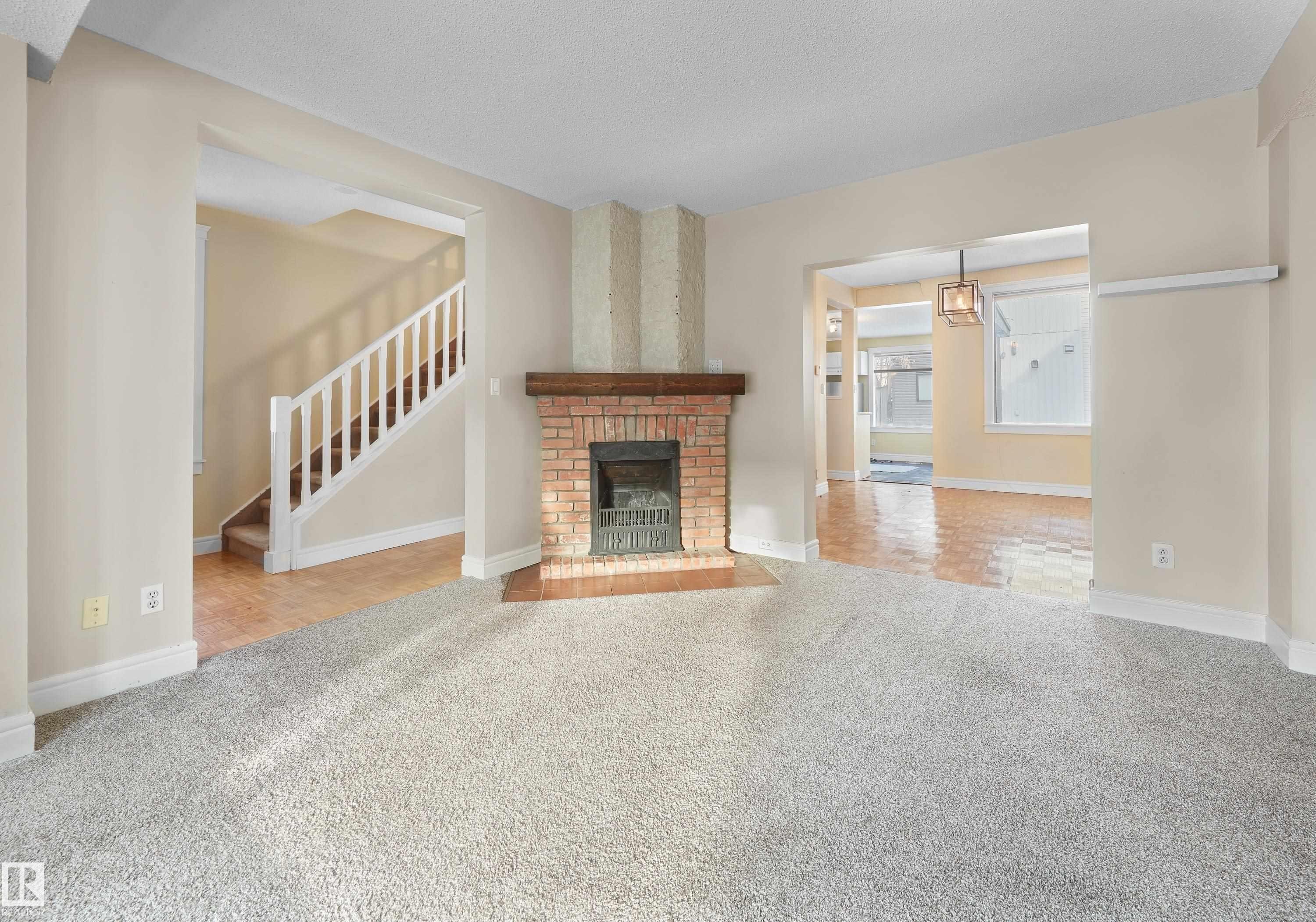 11212 75 Avenue, Edmonton, AB - Indoor Photo Showing Living Room With Fireplace