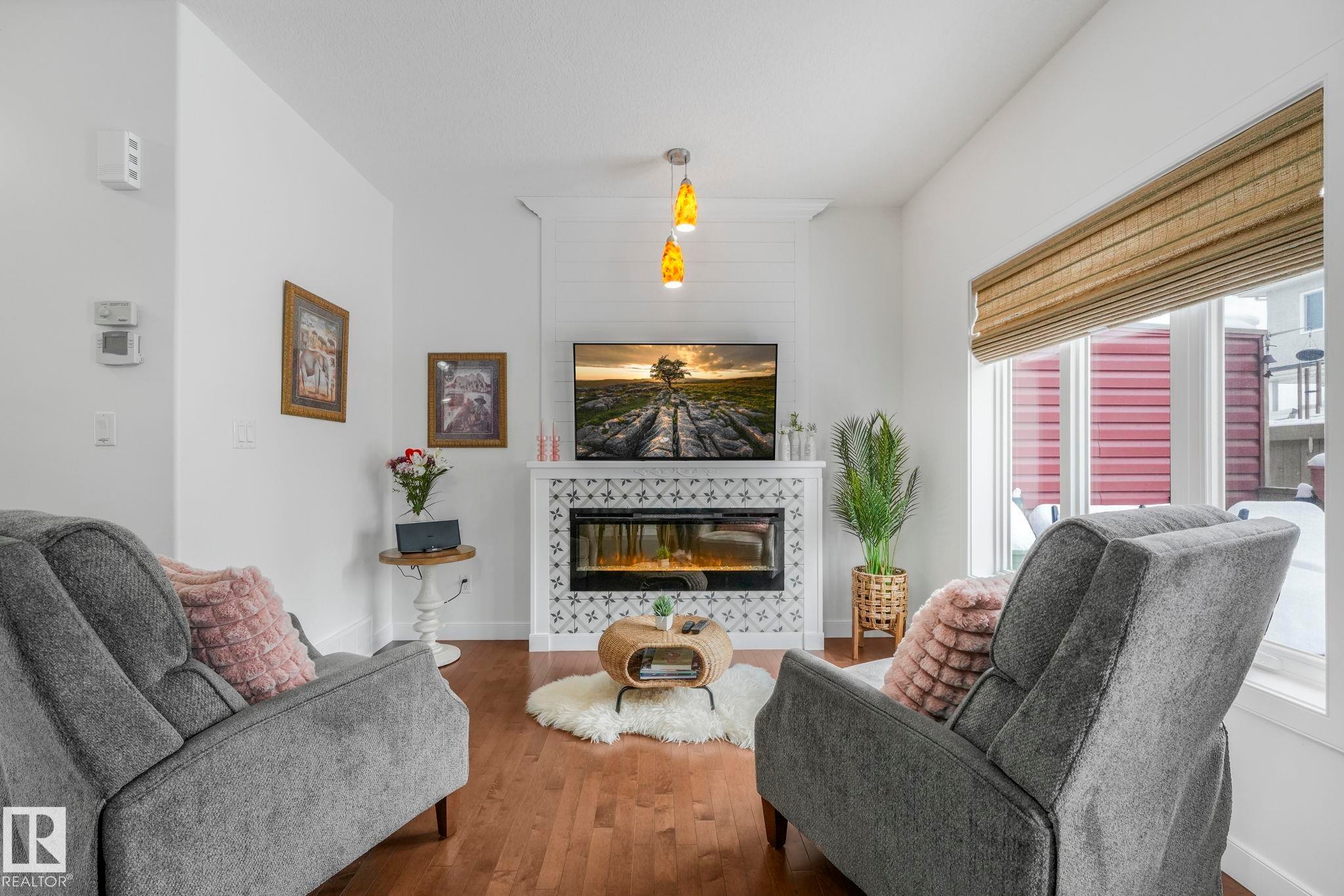 3 450 Mcconachie Way, Edmonton, AB - Indoor Photo Showing Living Room With Fireplace