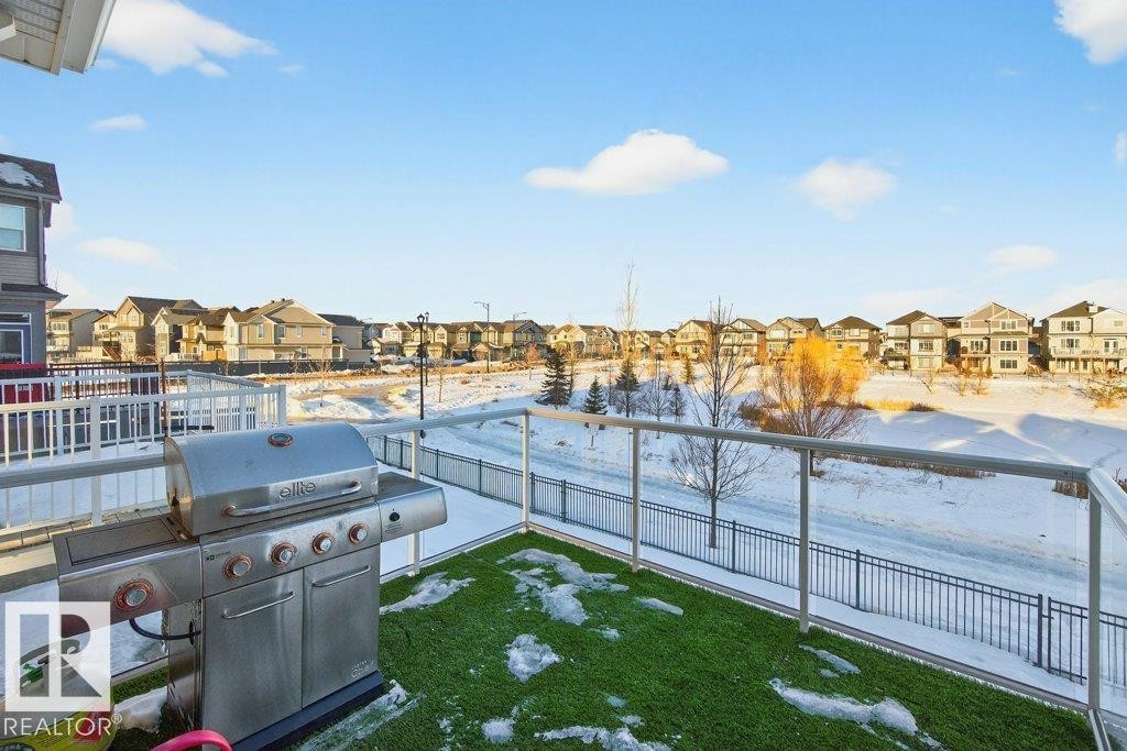 View onto elevated walkout deck off of kitchen nook. - 1909 Davidson Wynd, Edmonton, AB - Outdoor