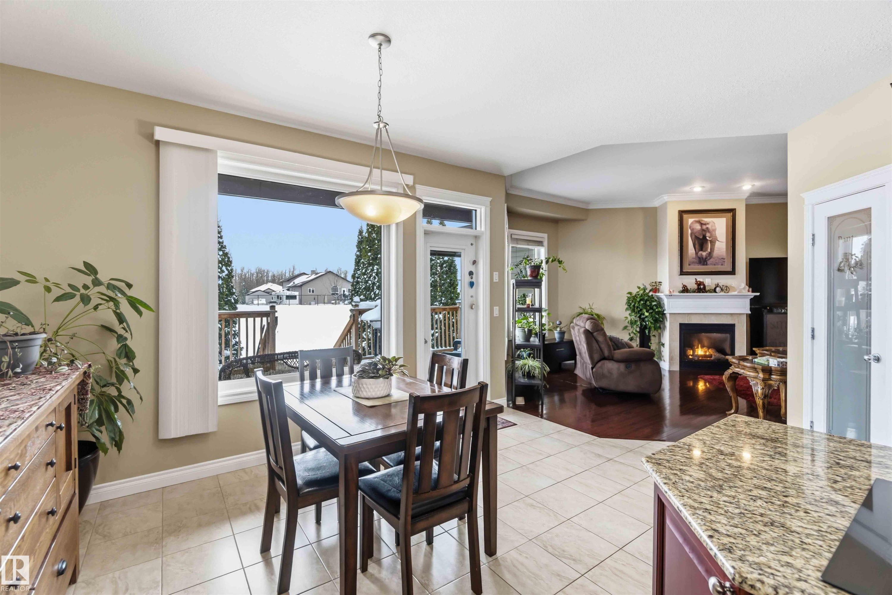 40 Landing Trails Drive, Gibbons, AB - Indoor Photo Showing Dining Room With Fireplace