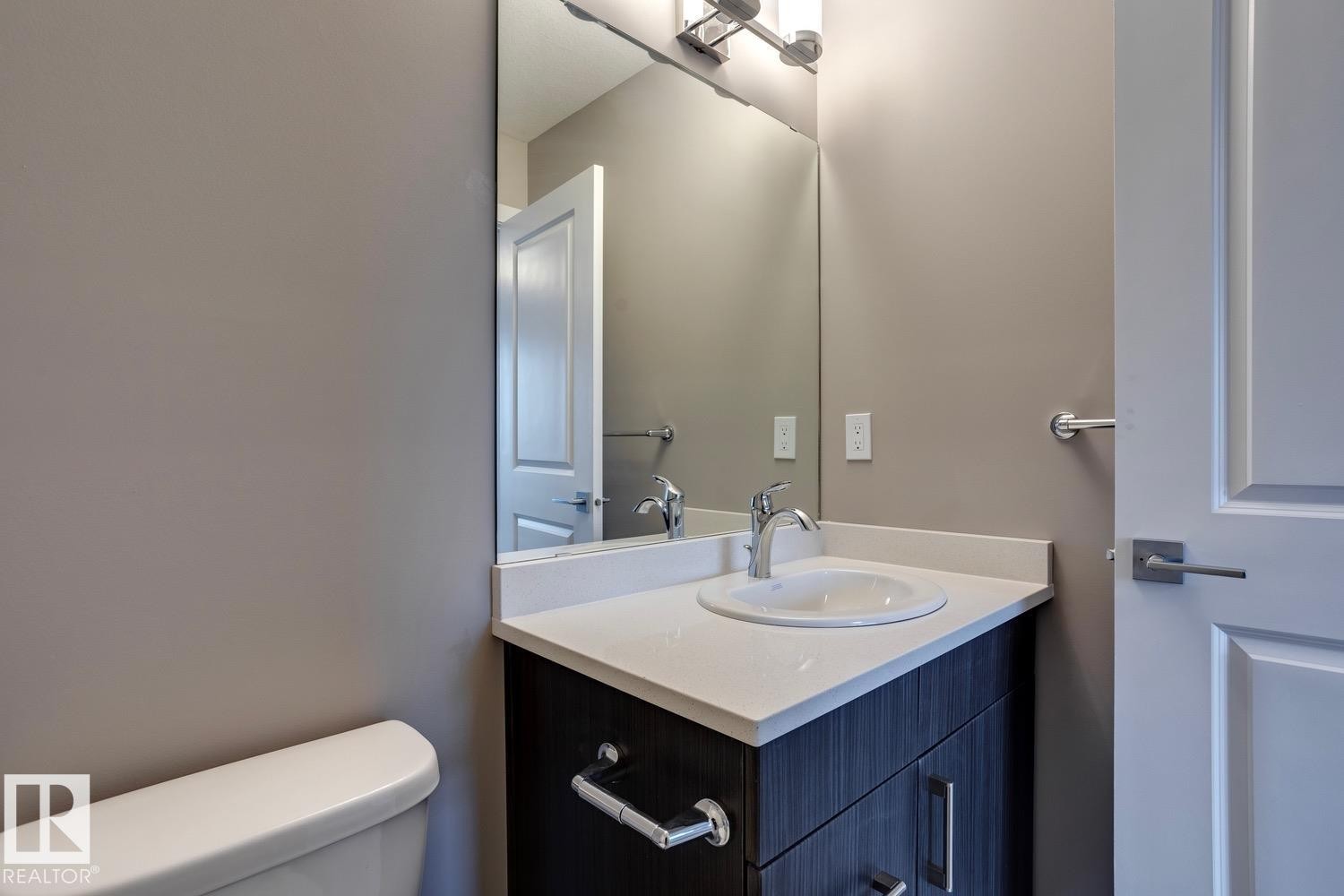 Bathroom featuring toilet and vanity - 78 13139 205 Street Nw, Edmonton, AB - Indoor Photo Showing Bathroom