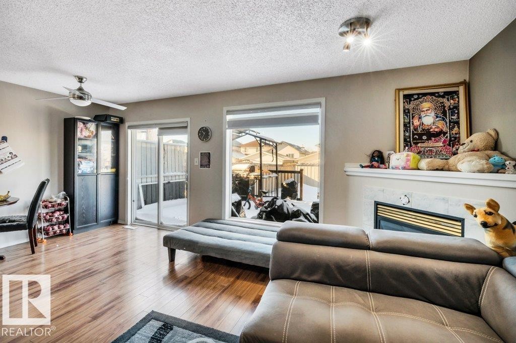 2920 30 Street, Edmonton, AB - Indoor Photo Showing Living Room With Fireplace