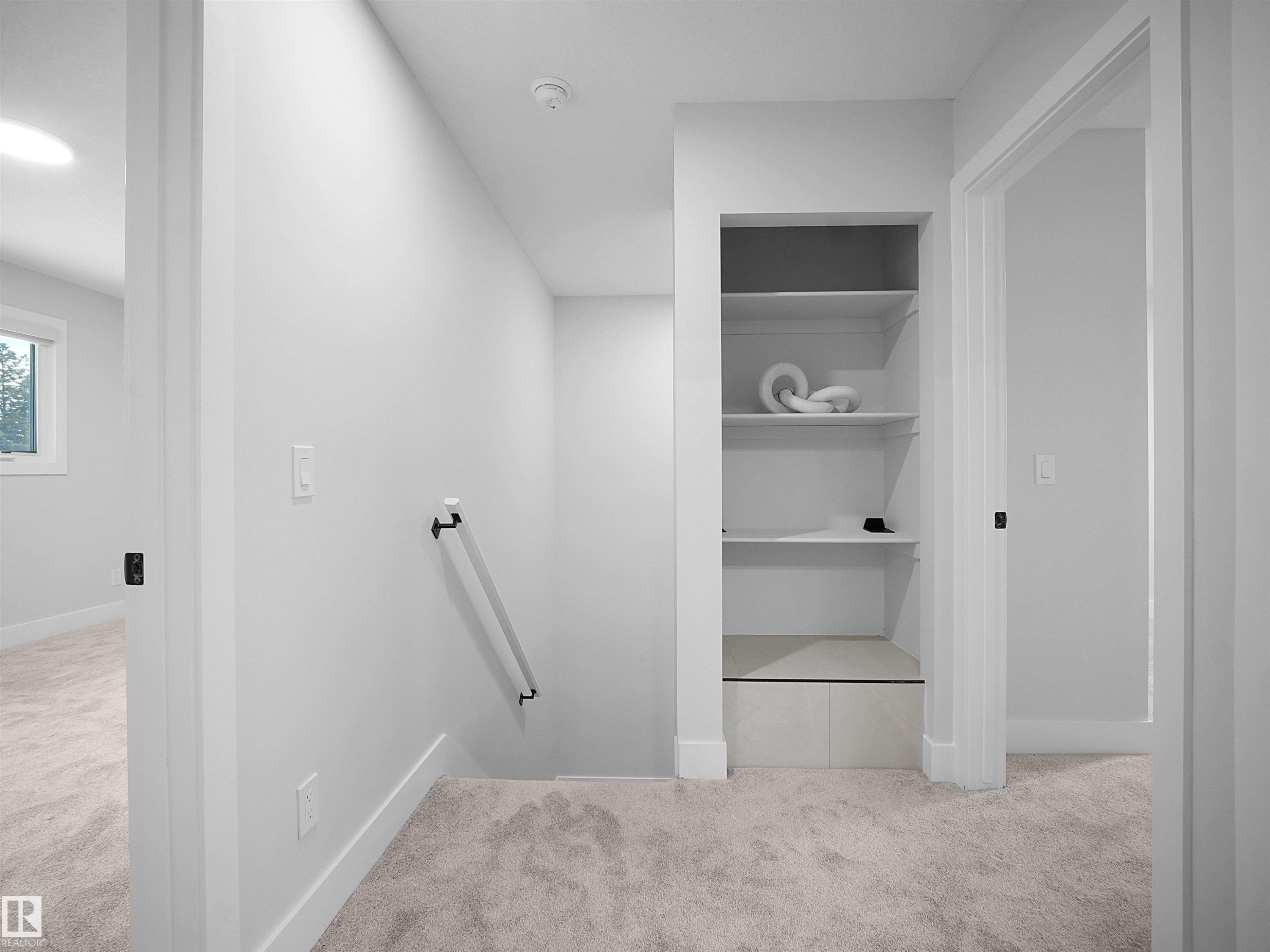 Hallway with light colored carpet and an upstairs landing - 9409 173 Street, Edmonton, AB - Indoor Photo Showing Other Room