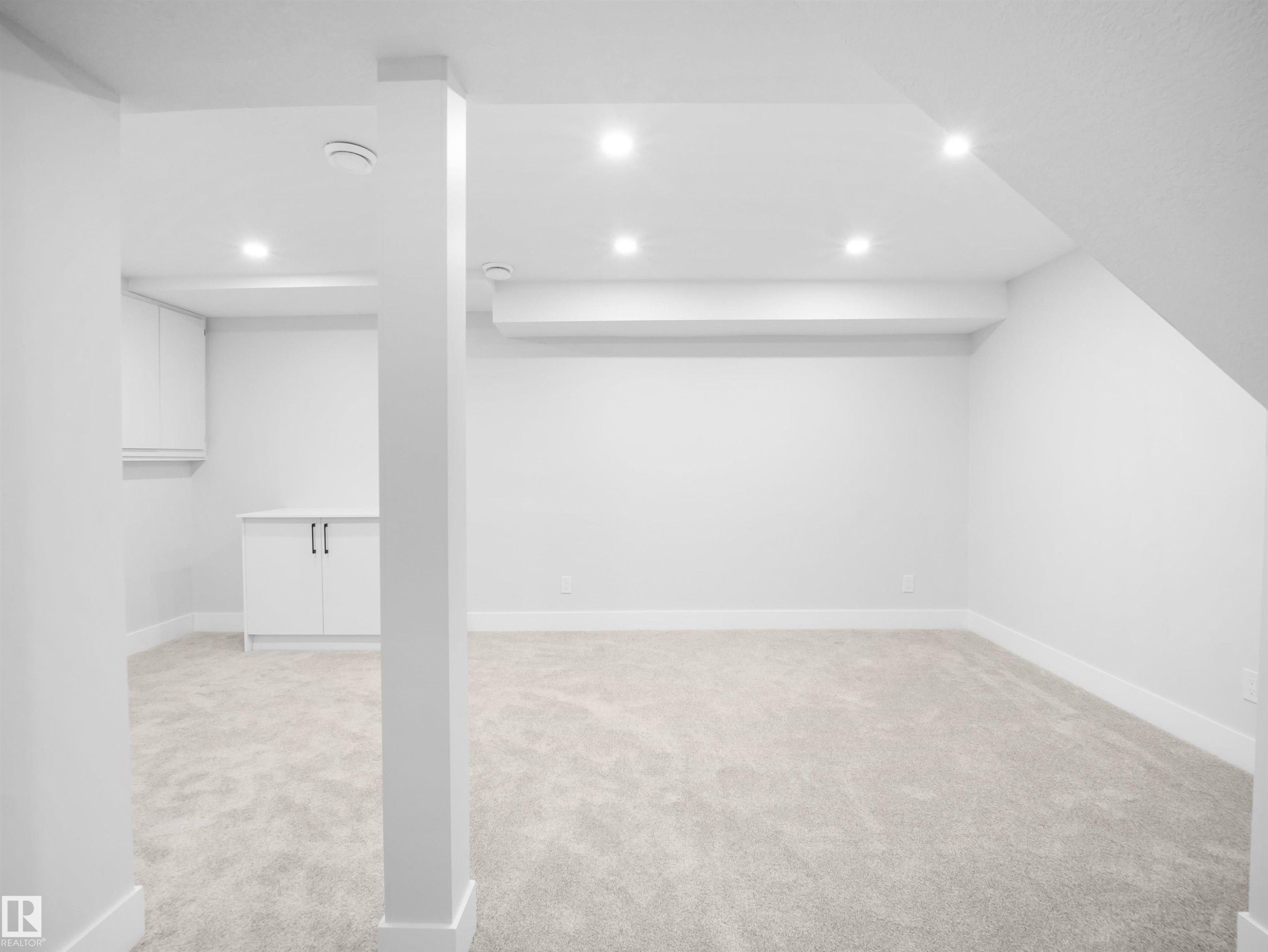 Finished basement with light colored carpet and recessed lighting - 9409 173 Street, Edmonton, AB - Indoor Photo Showing Other Room