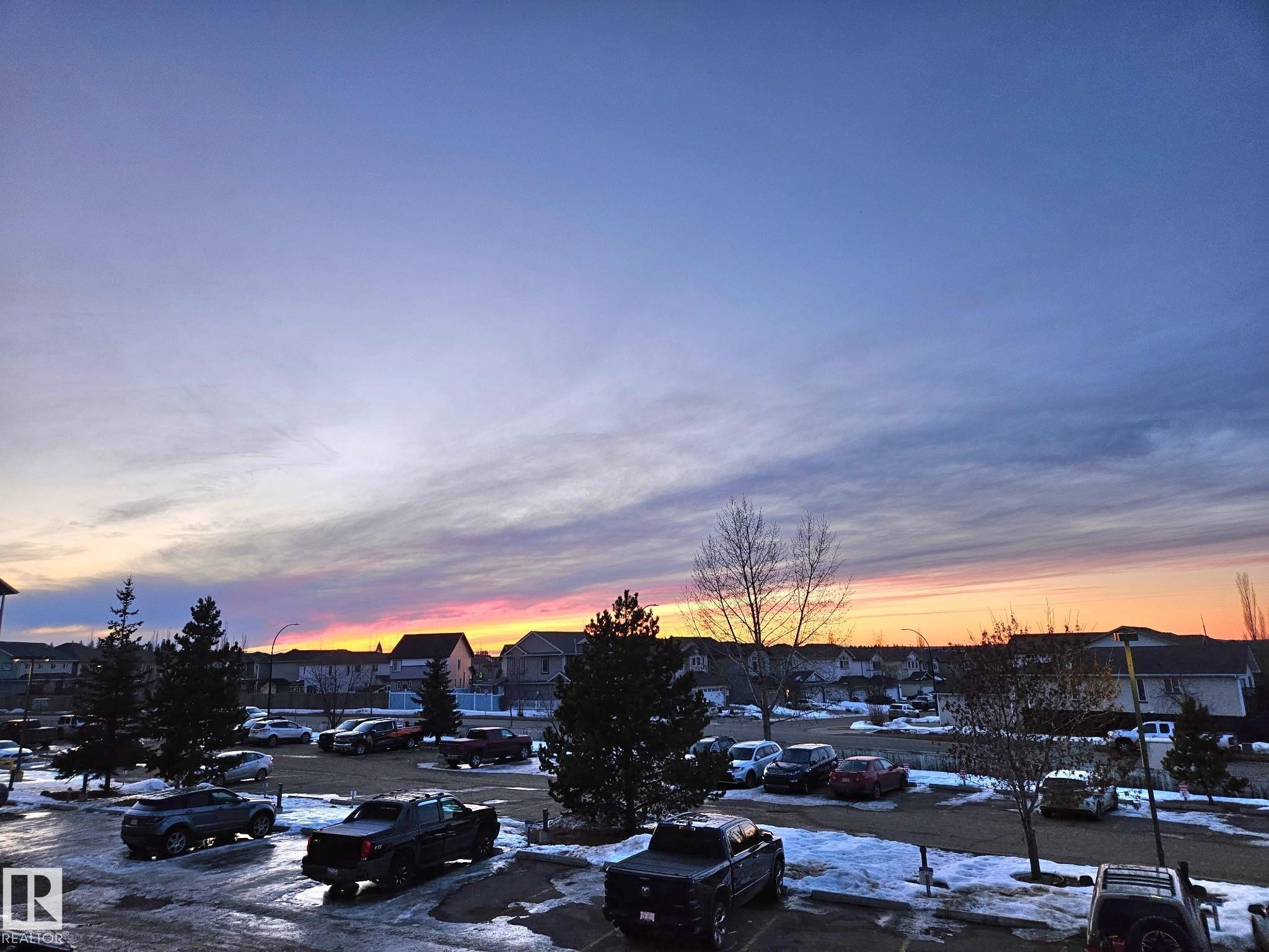 Sunset view from the balcony. - 204 240 Spruce Ridge Road, Spruce Grove, AB - Outdoor With View