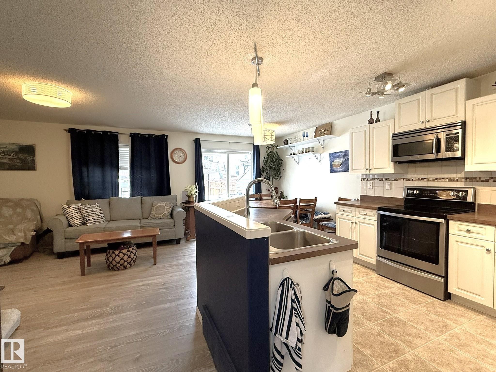 735 Kananaskis Drive, Devon, AB - Indoor Photo Showing Kitchen With Double Sink