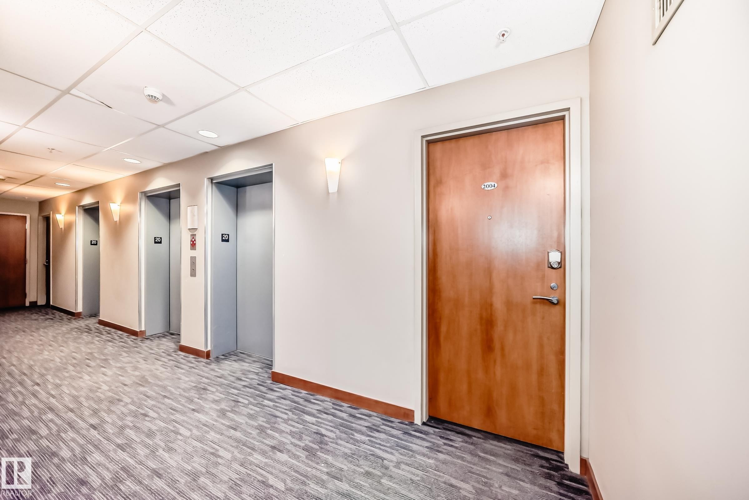 Community lobby featuring a paneled ceiling - 2004 10136 104 Street, Edmonton, AB - Indoor Photo Showing Other Room