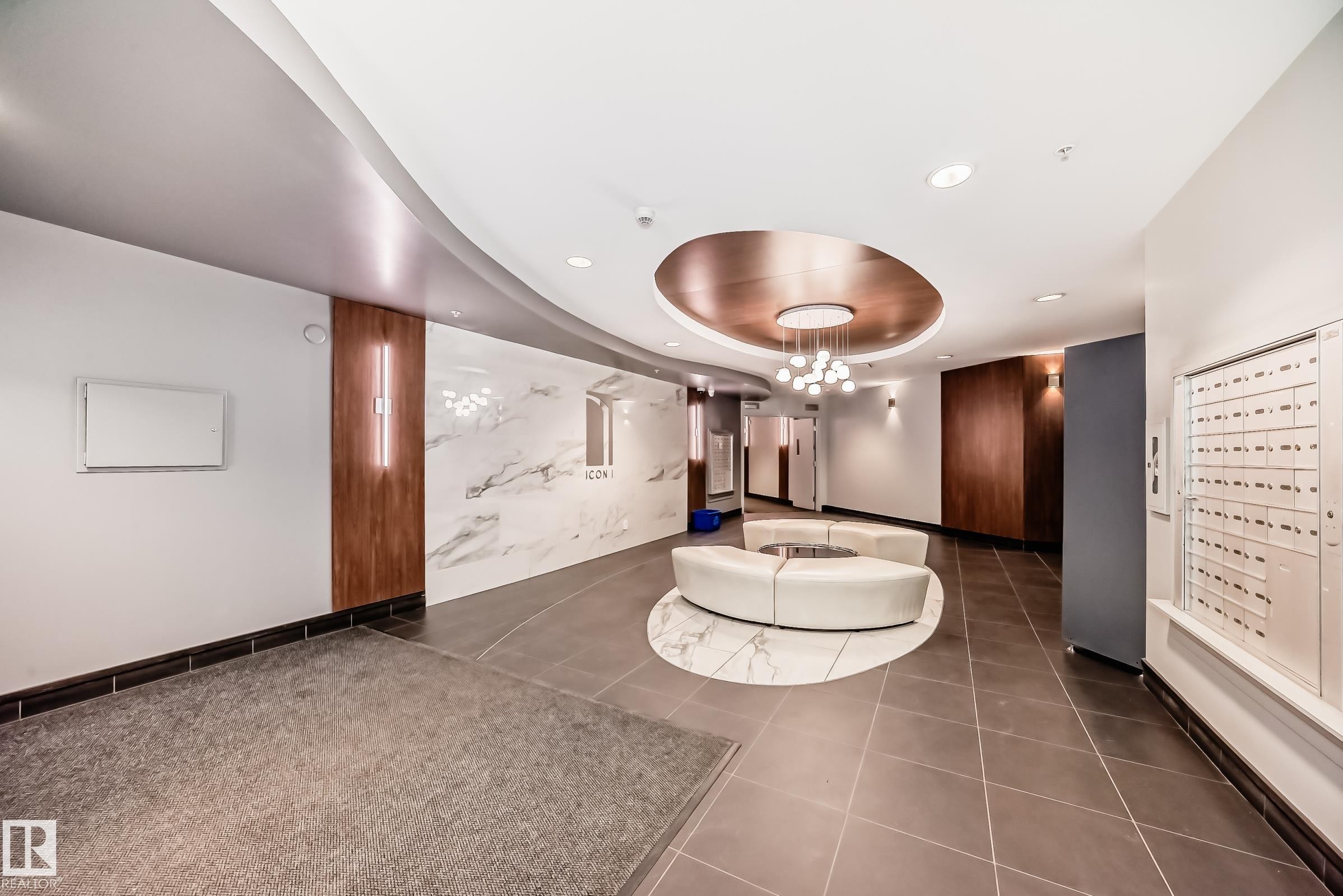 Community lobby featuring a tray ceiling and recessed lighting - 2004 10136 104 Street, Edmonton, AB - Indoor Photo Showing Other Room