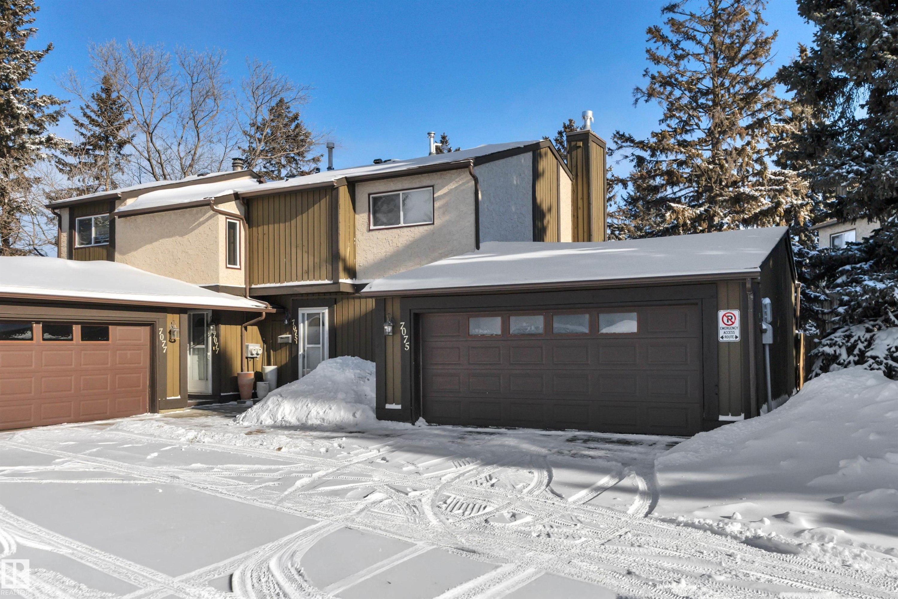 View of front of house featuring a chimney and a garage - 7075 32 Avenue, Edmonton, AB - Outdoor