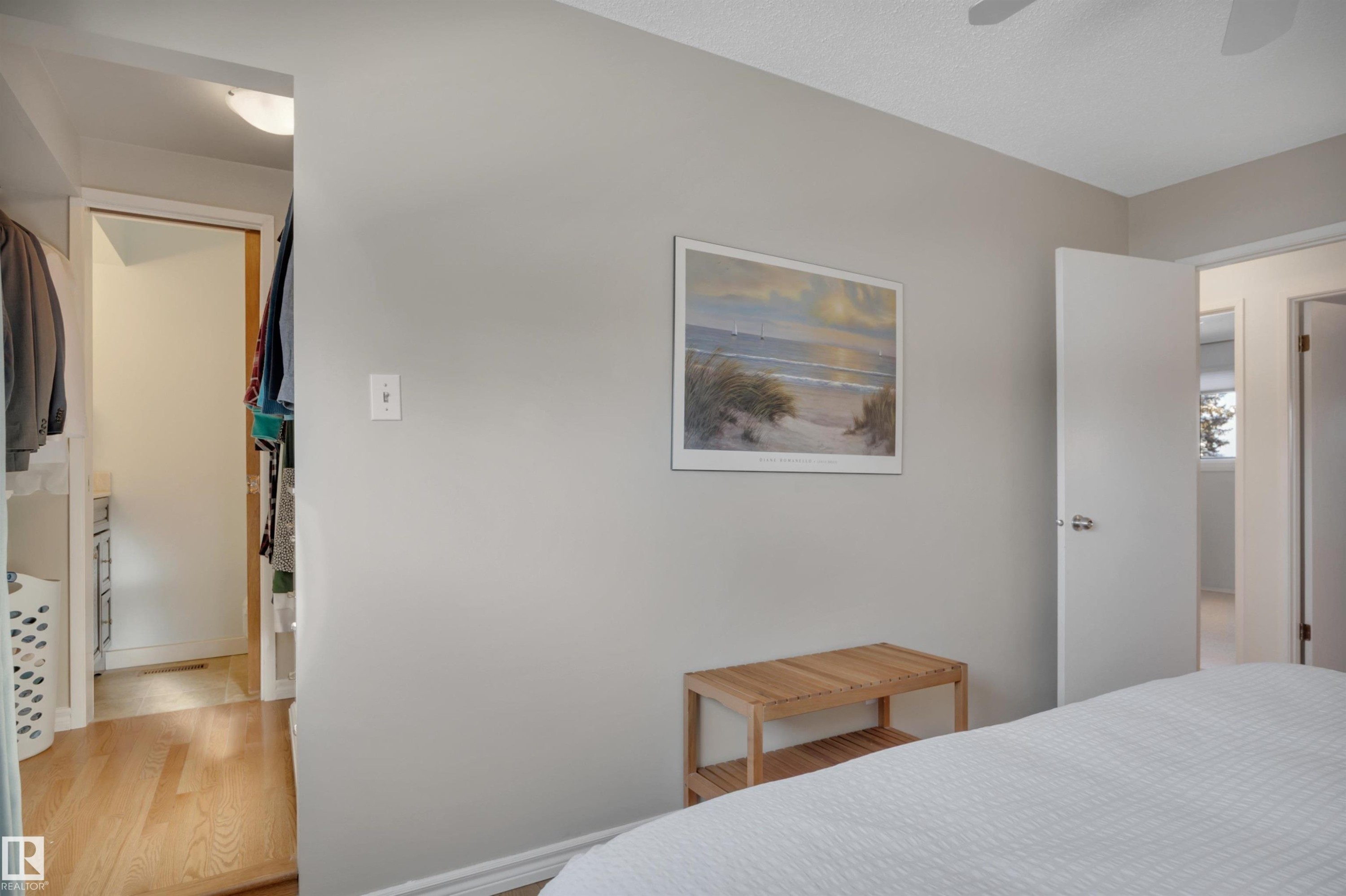Bedroom with wood finished floors and ceiling fan - 7075 32 Avenue, Edmonton, AB - Indoor Photo Showing Bedroom