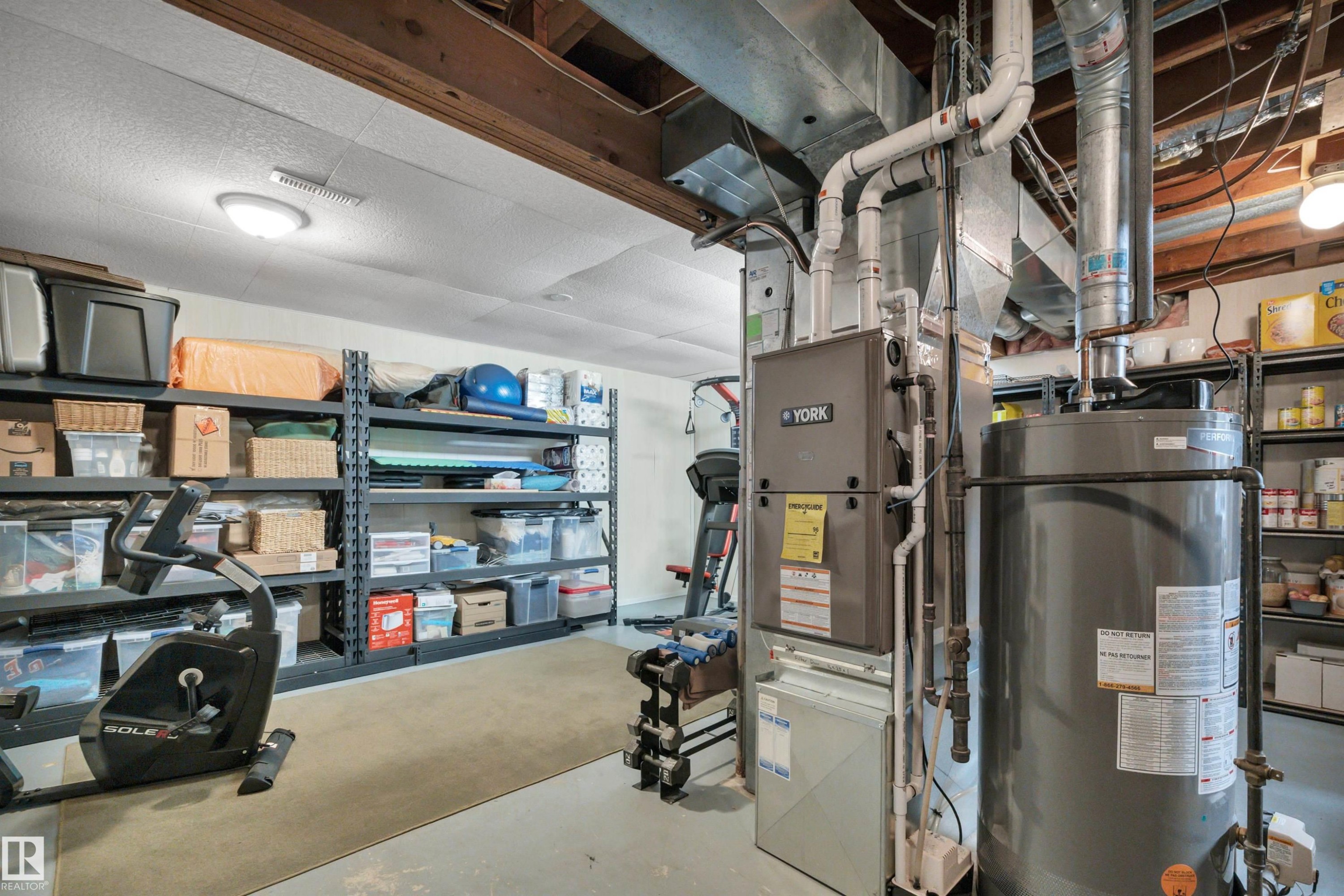 Utilities featuring gas water heater - 7075 32 Avenue, Edmonton, AB - Indoor Photo Showing Basement