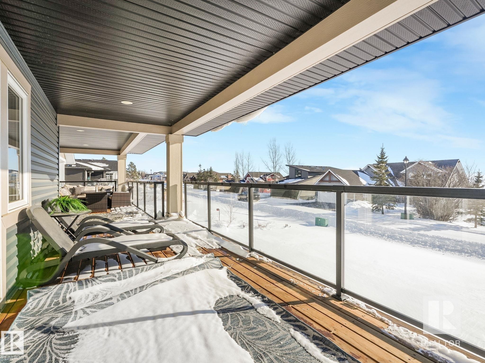 Balcony with a residential view - 209 55101 Ste. Anne Trail, Rural Lac Ste. Anne County, AB - Outdoor With Exterior