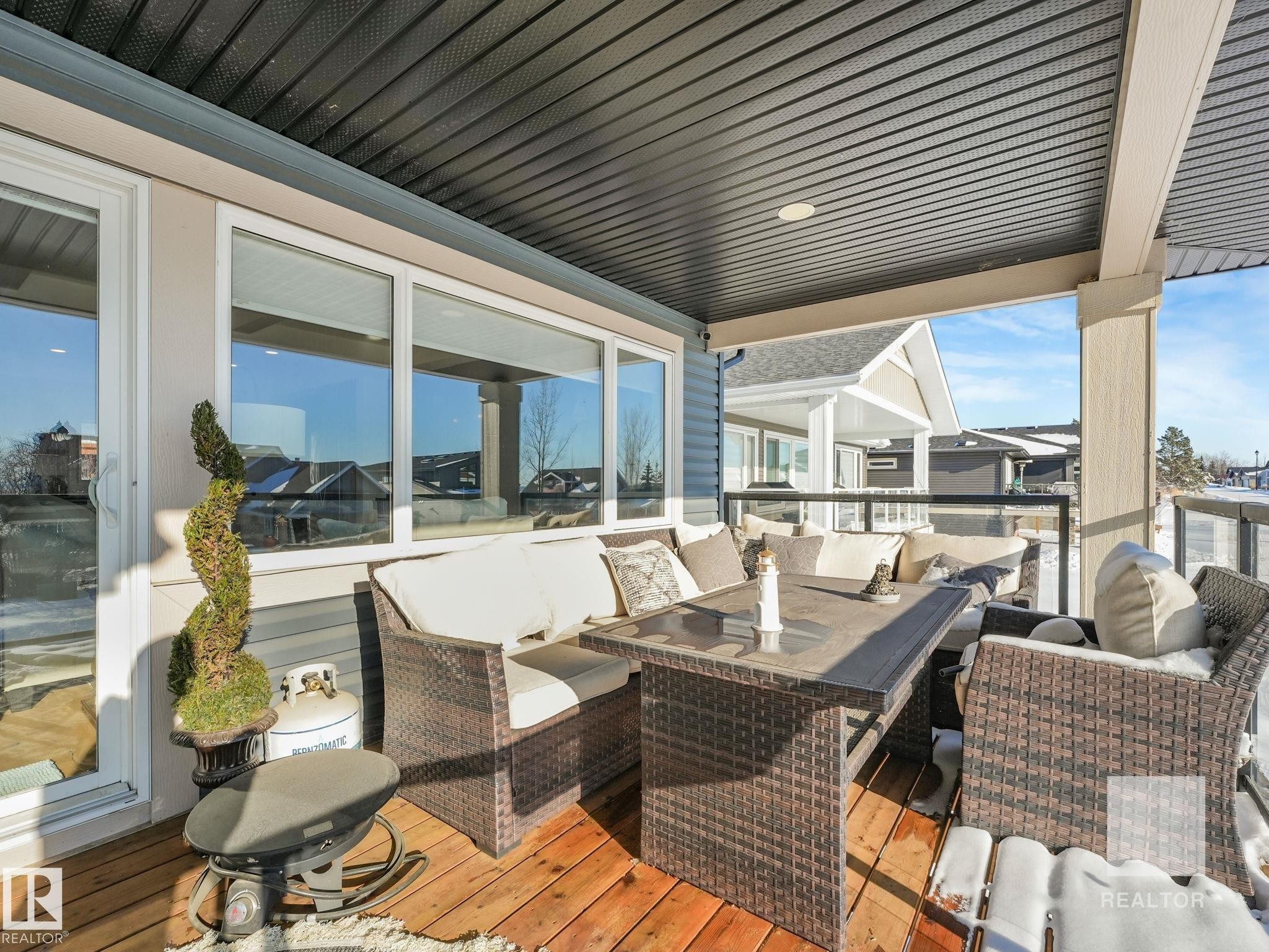 Wooden terrace featuring outdoor furniture - 209 55101 Ste. Anne Trail, Rural Lac Ste. Anne County, AB - Outdoor With Deck Patio Veranda With Exterior