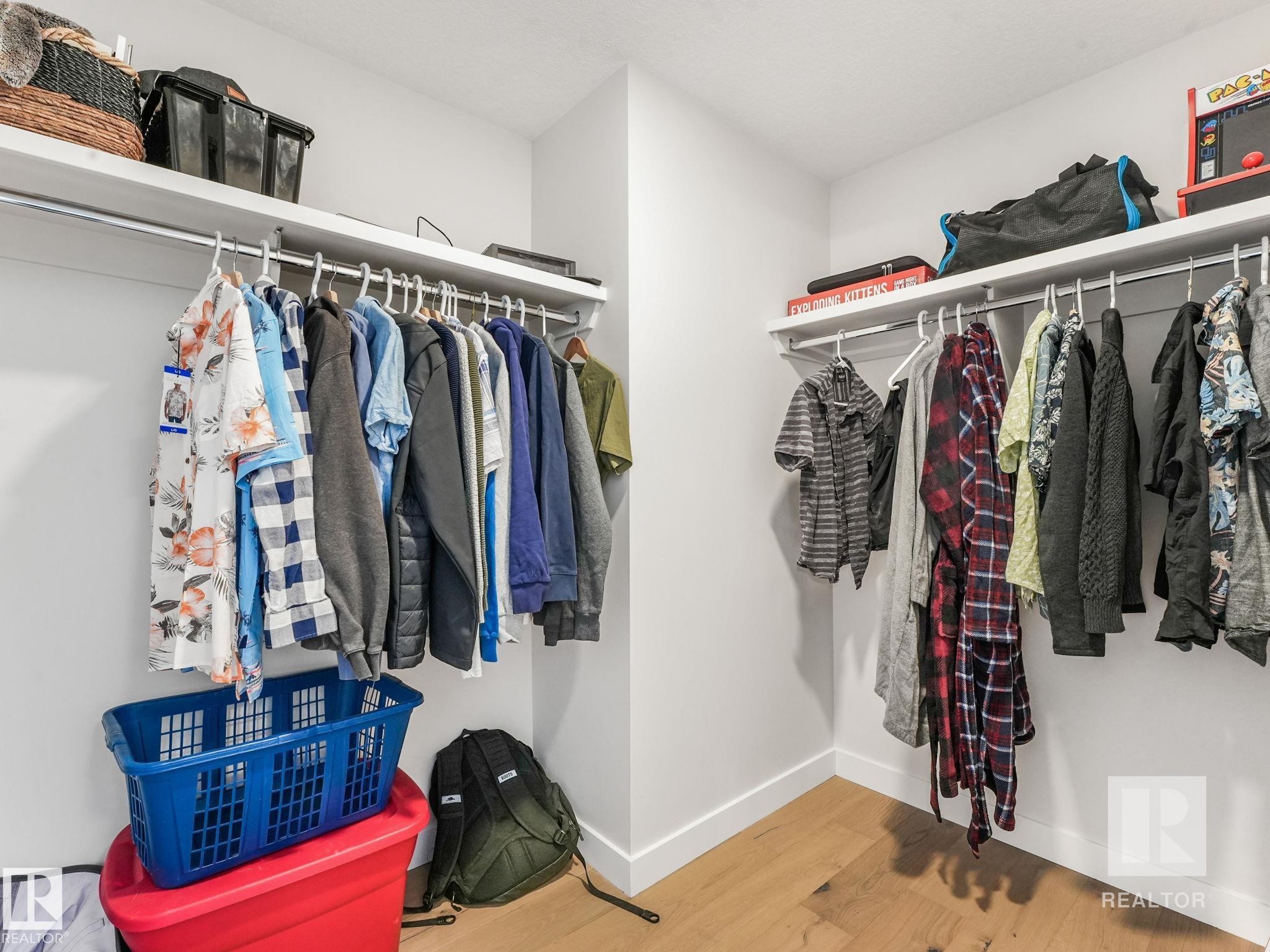 Walk in closet featuring wood finished floors - 209 55101 Ste. Anne Trail, Rural Lac Ste. Anne County, AB - Indoor With Storage