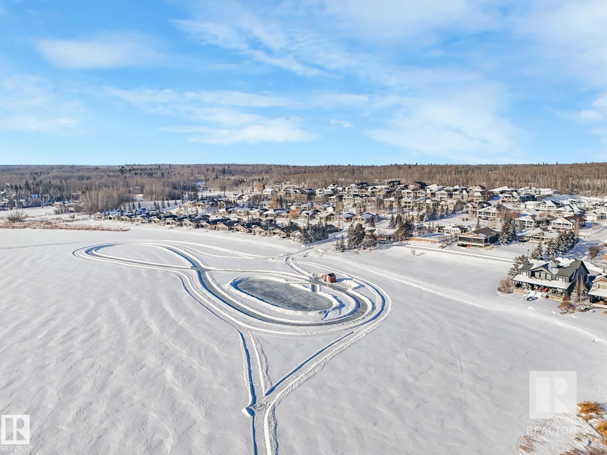 Aerial view of residential area - 209 55101 Ste. Anne Trail, Rural Lac Ste. Anne County, AB - Outdoor With View