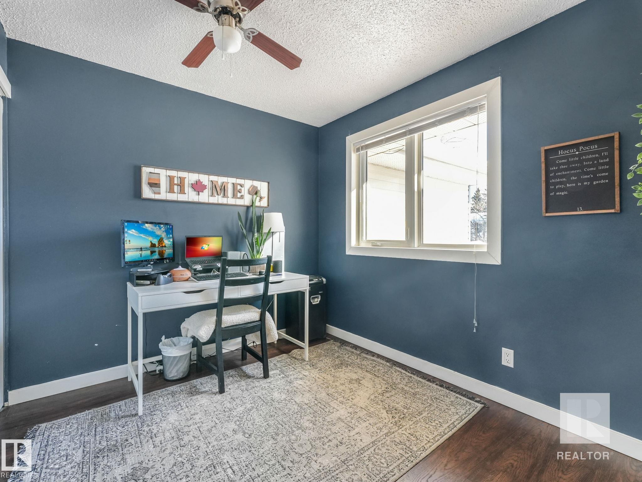 Home office with wood finished floors, a ceiling fan, and a textured ceiling - 4504 48 Avenue, Onoway, AB - Indoor Photo Showing Office