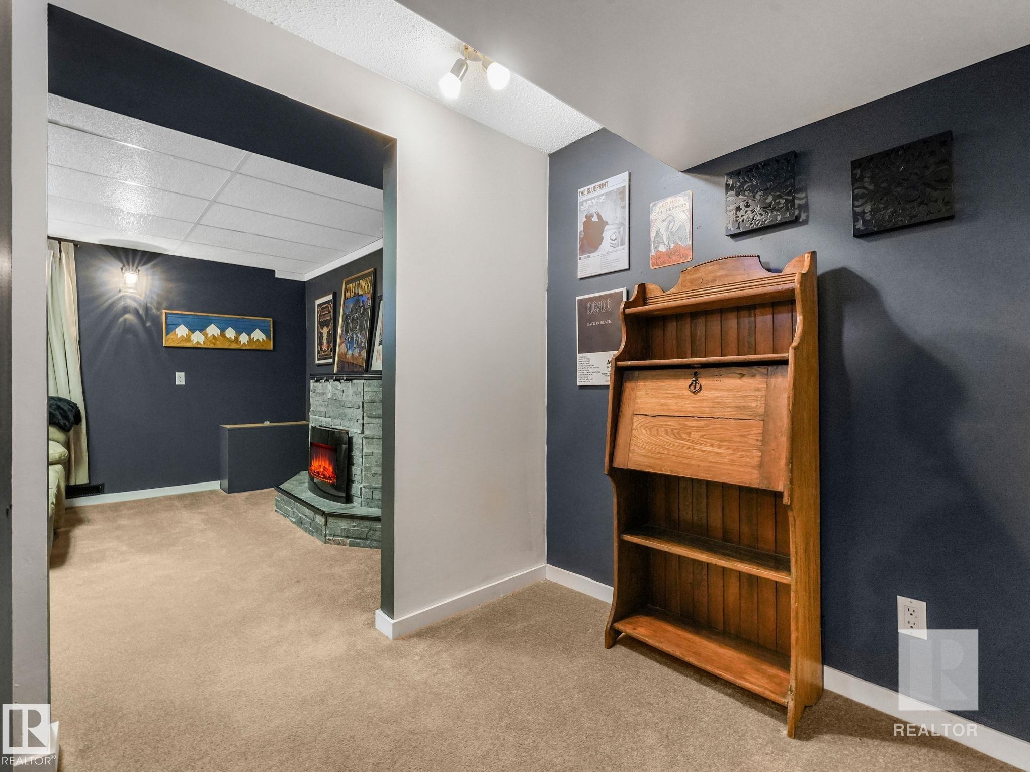 Corridor featuring light carpet and a drop ceiling - 4504 48 Avenue, Onoway, AB - Indoor